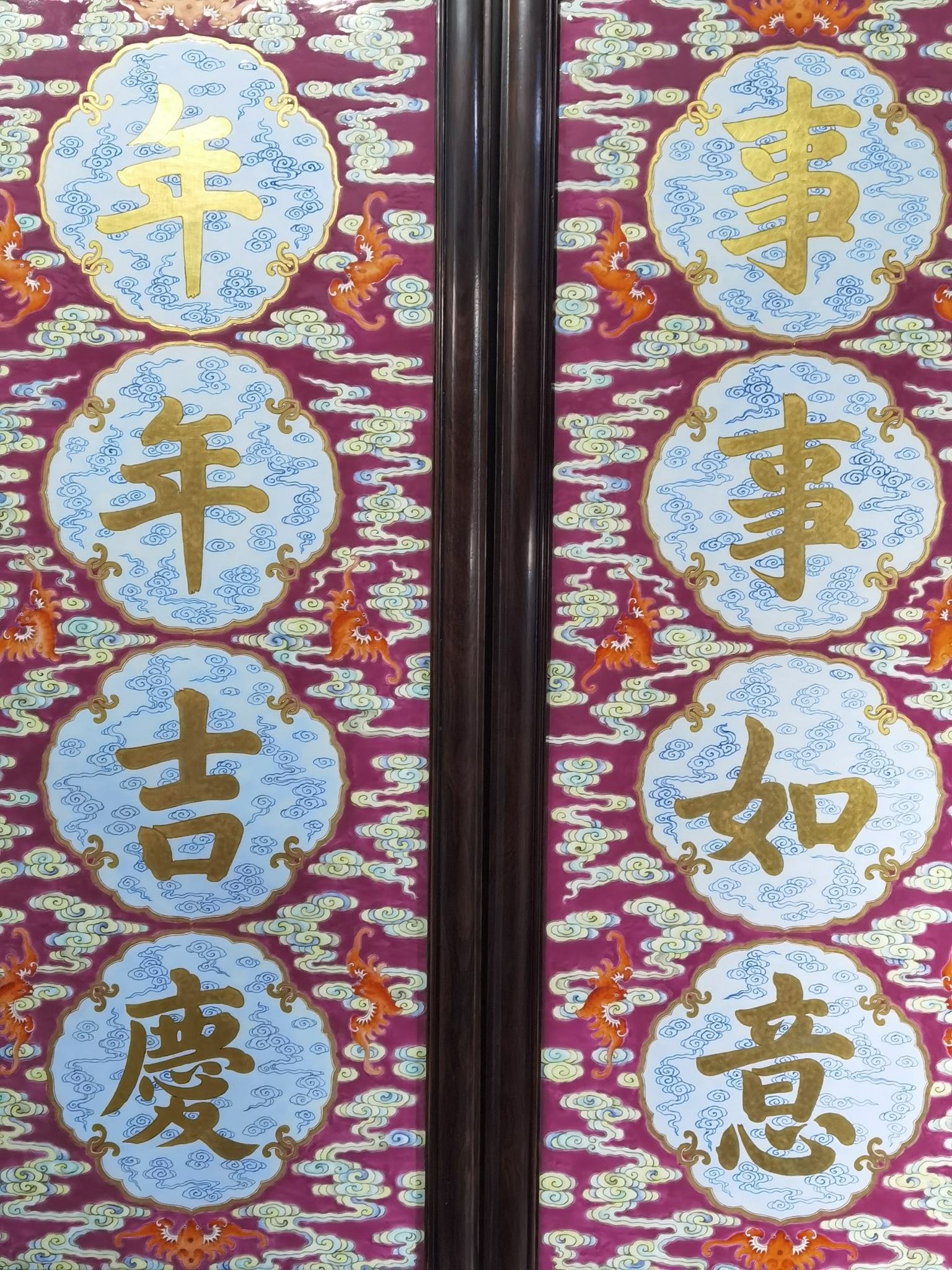 Qing Dynasty Qianlong rouge ground pastel and gold pair of porcelain plates