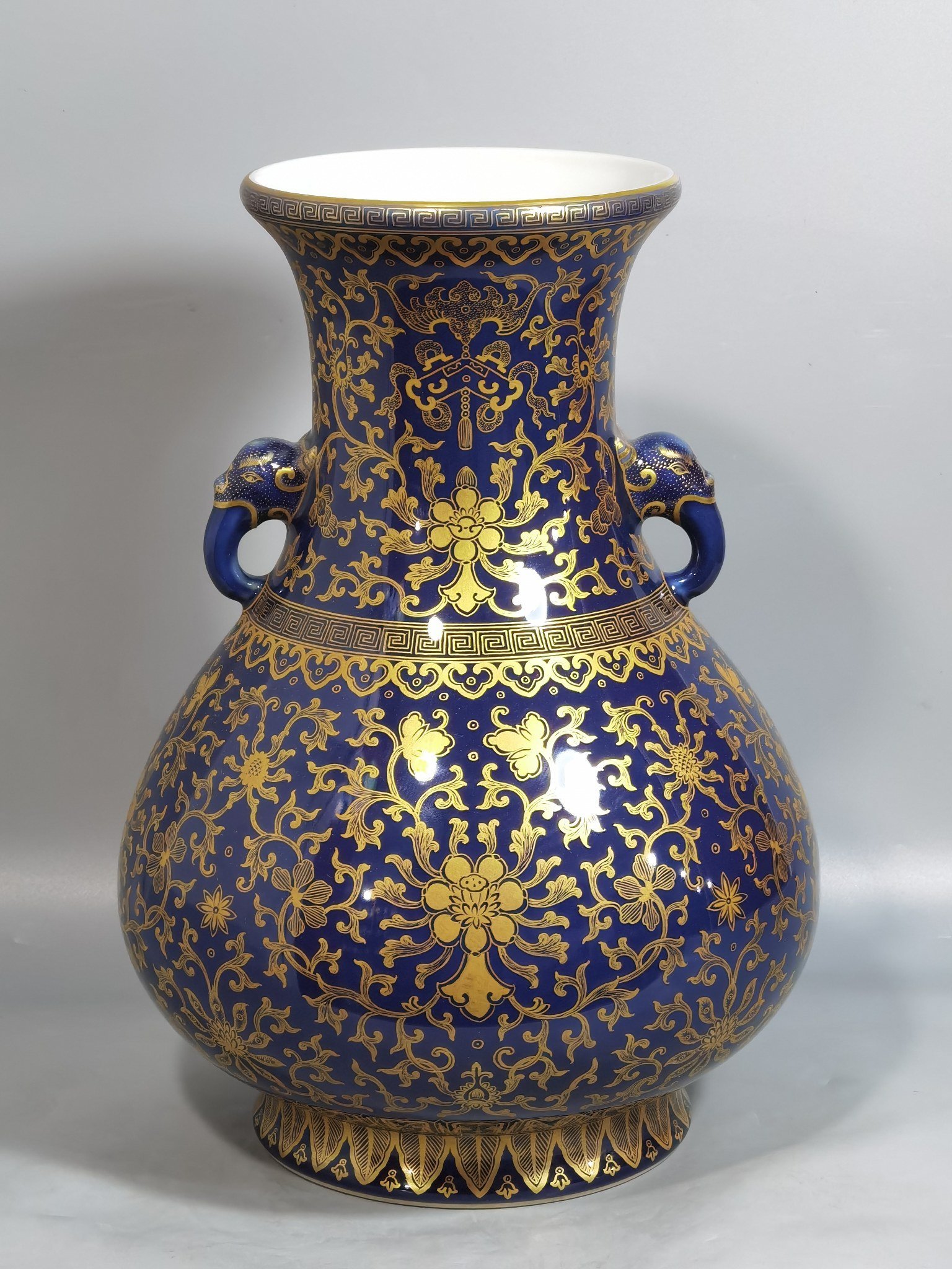 Qing Dynasty Qianlong purse blue glaze painted with gold and longevity lotus pattern elephant ear vase