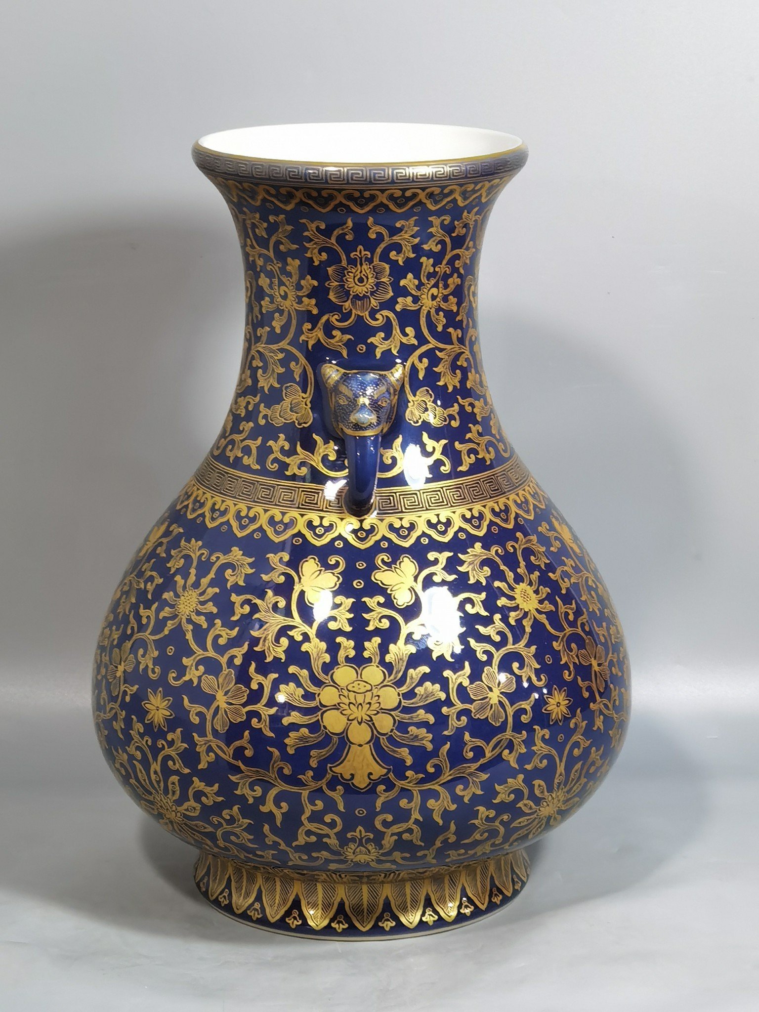 Qing Dynasty Qianlong purse blue glaze painted with gold and longevity lotus pattern elephant ear vase