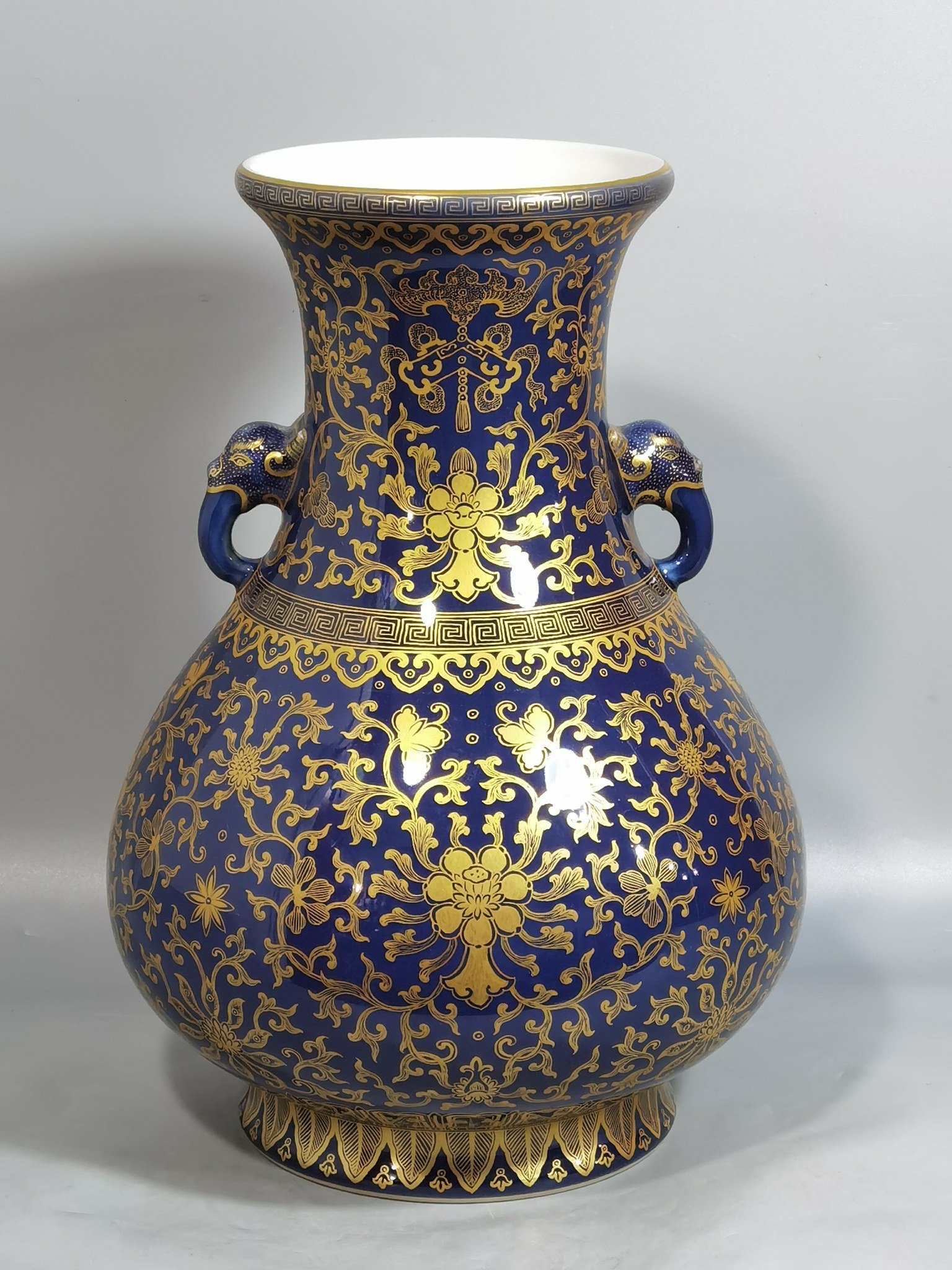 Qing Dynasty Qianlong purse blue glaze painted with gold and longevity lotus pattern elephant ear vase