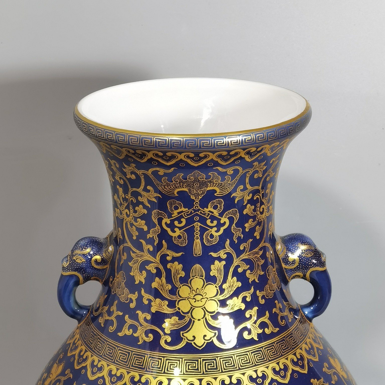 Qing Dynasty Qianlong purse blue glaze painted with gold and longevity lotus pattern elephant ear vase