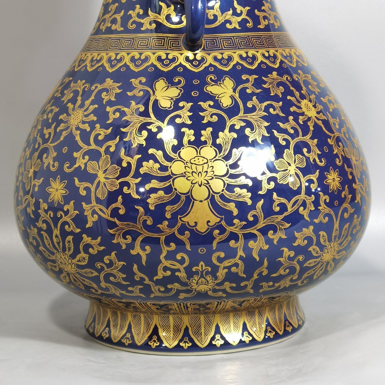 Qing Dynasty Qianlong purse blue glaze painted with gold and longevity lotus pattern elephant ear vase