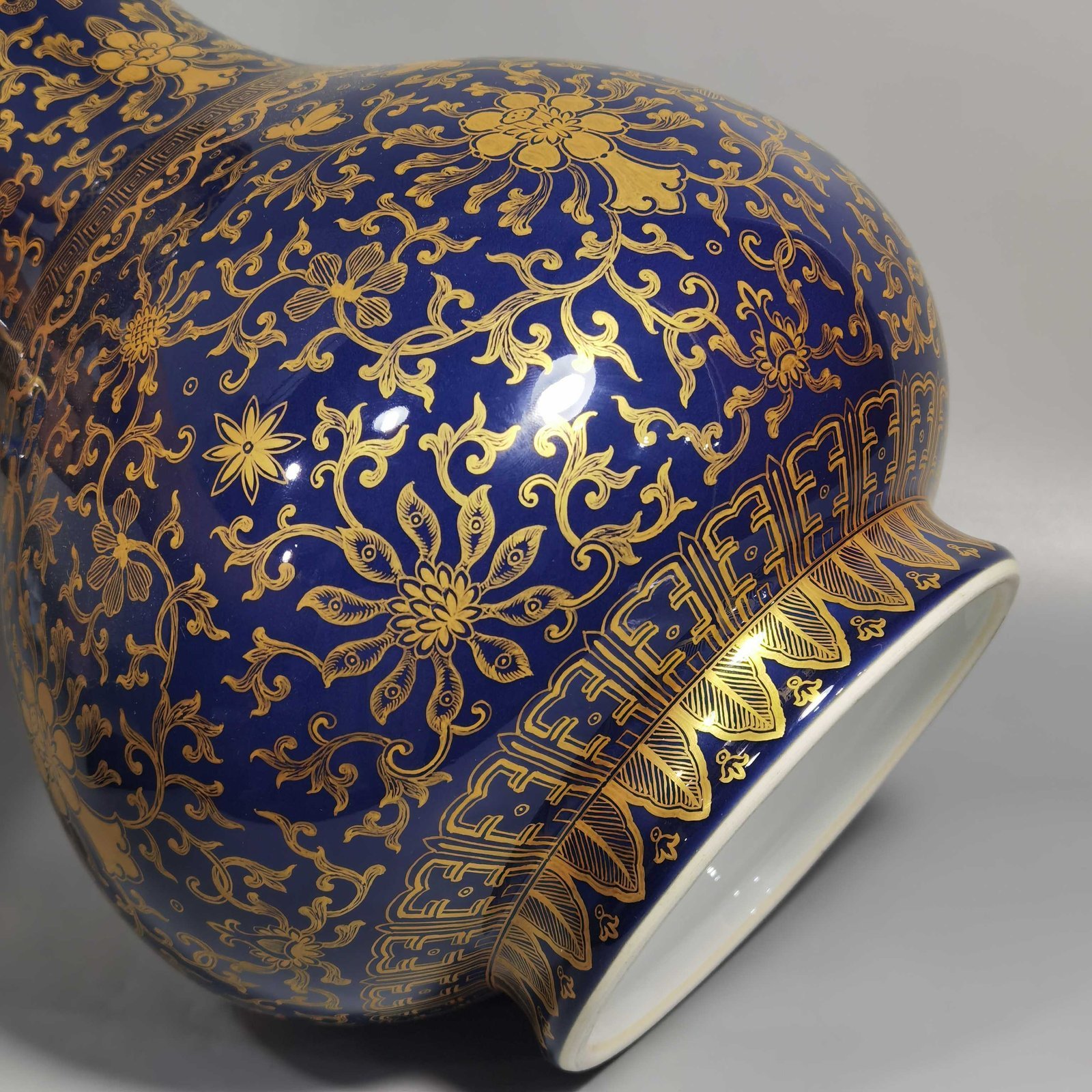 Qing Dynasty Qianlong purse blue glaze painted with gold and longevity lotus pattern elephant ear vase