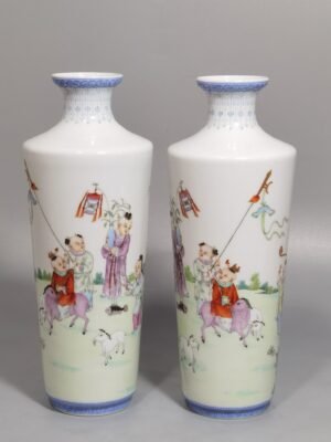 Qing Dynasty Qianlong green upper and lower edges pair of pastel boy vases