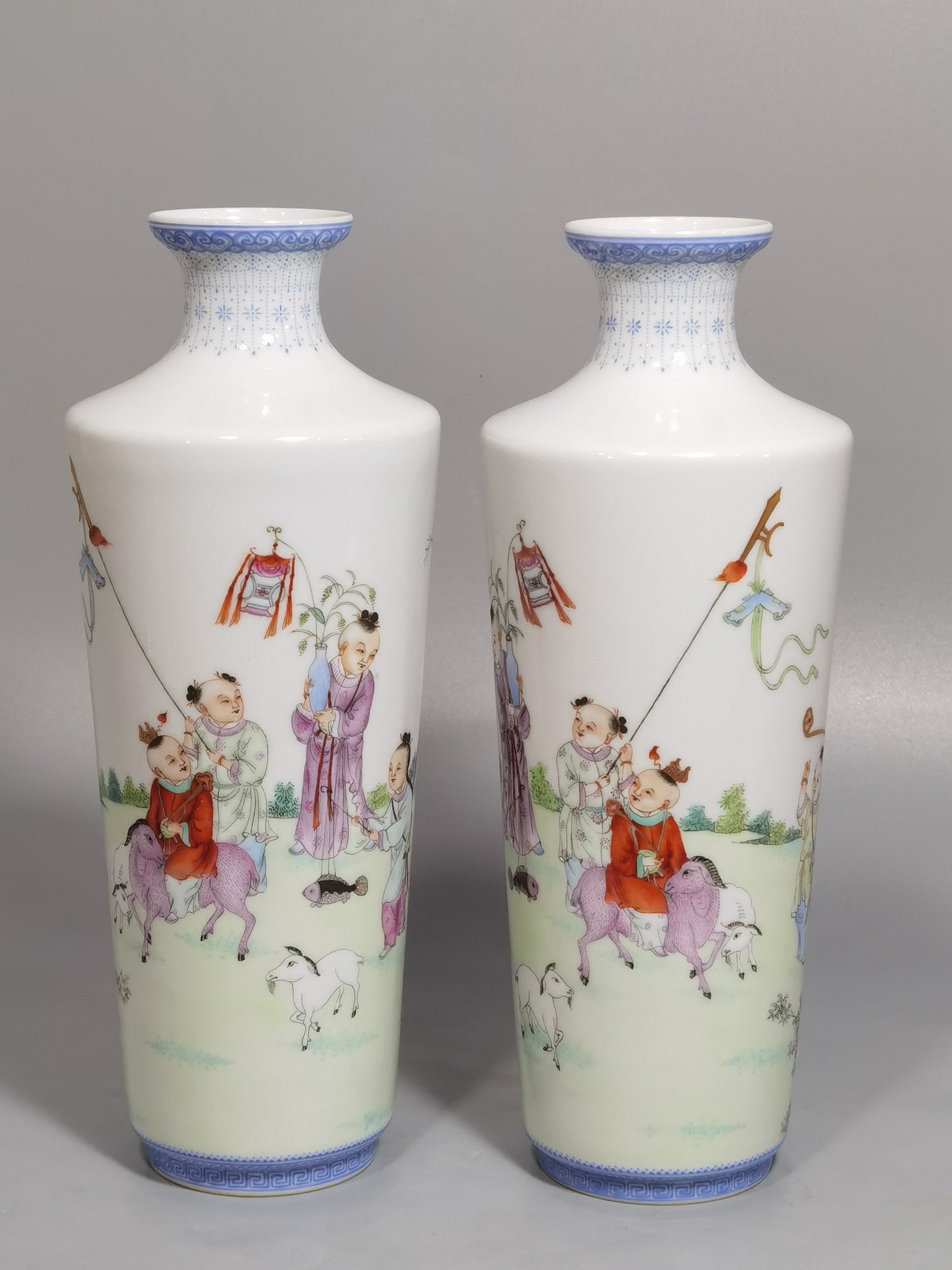 Qing Dynasty Qianlong green upper and lower edges pair of pastel boy vases