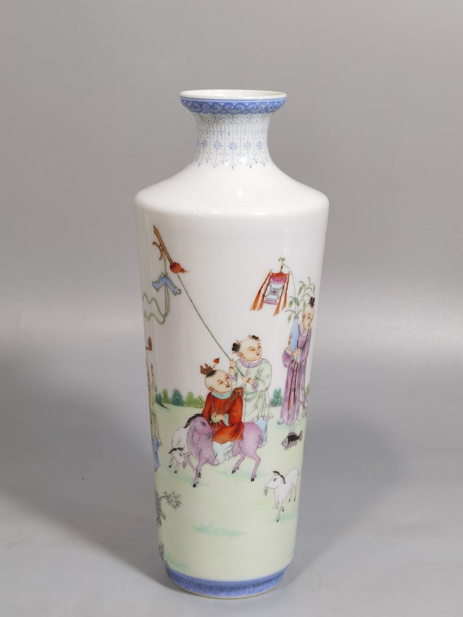 Qing Dynasty Qianlong green upper and lower edges pair of pastel boy vases