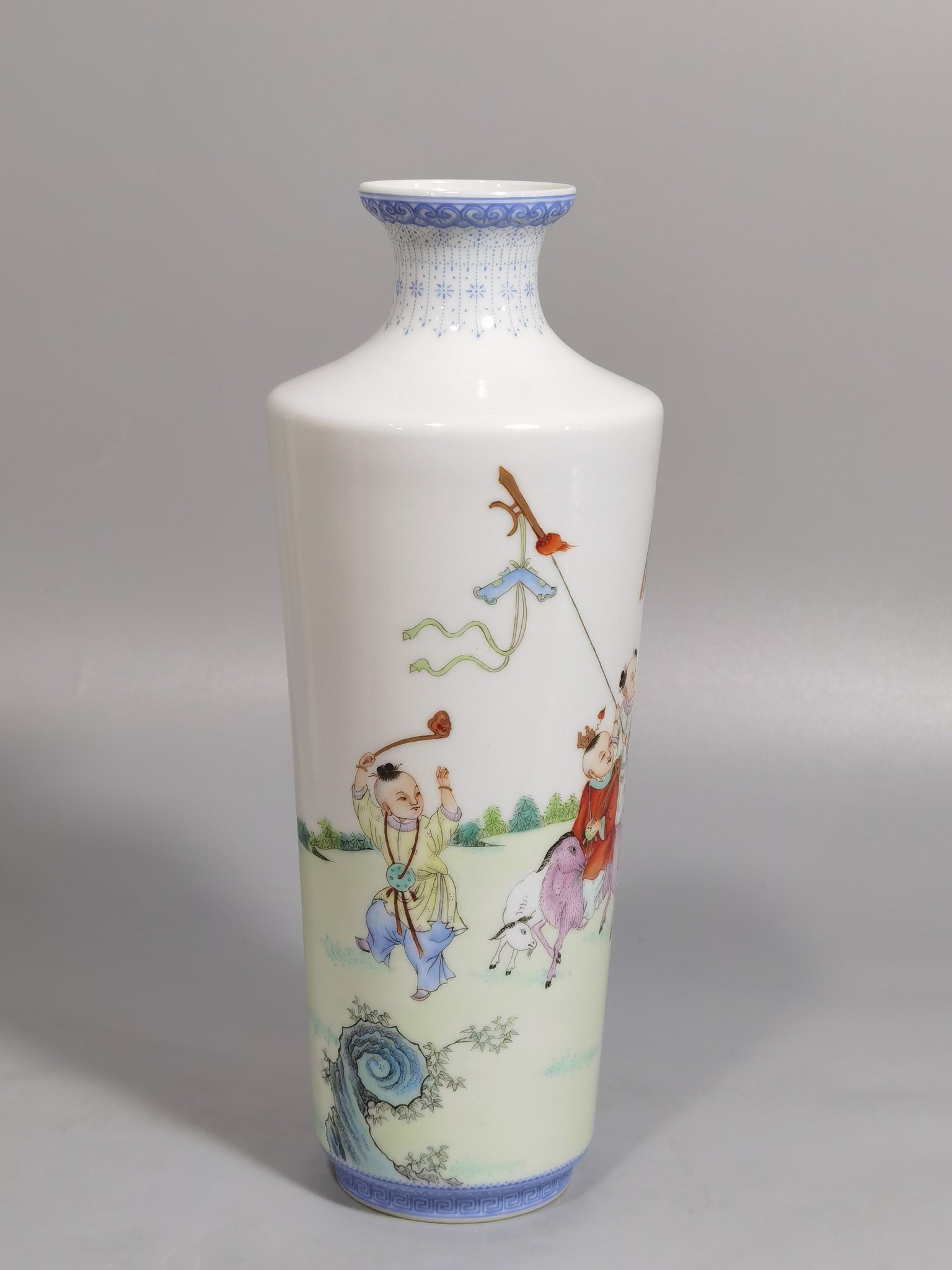 Qing Dynasty Qianlong green upper and lower edges pair of pastel boy vases
