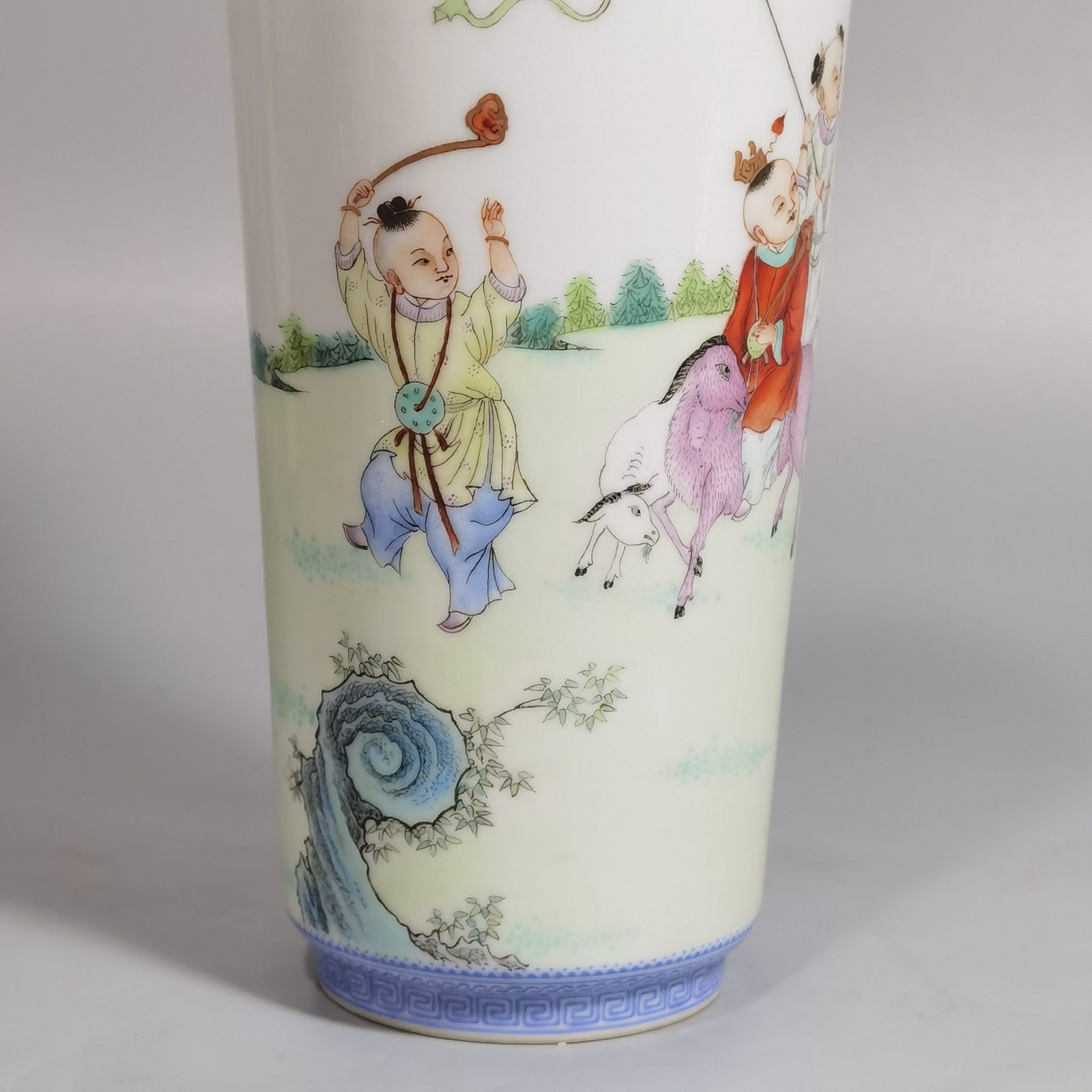 Qing Dynasty Qianlong green upper and lower edges pair of pastel boy vases