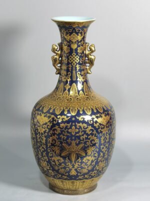Qing Dynasty Qianlong blue-painted golden treasure pattern with double-dragon ear and mouth-shaped bottle