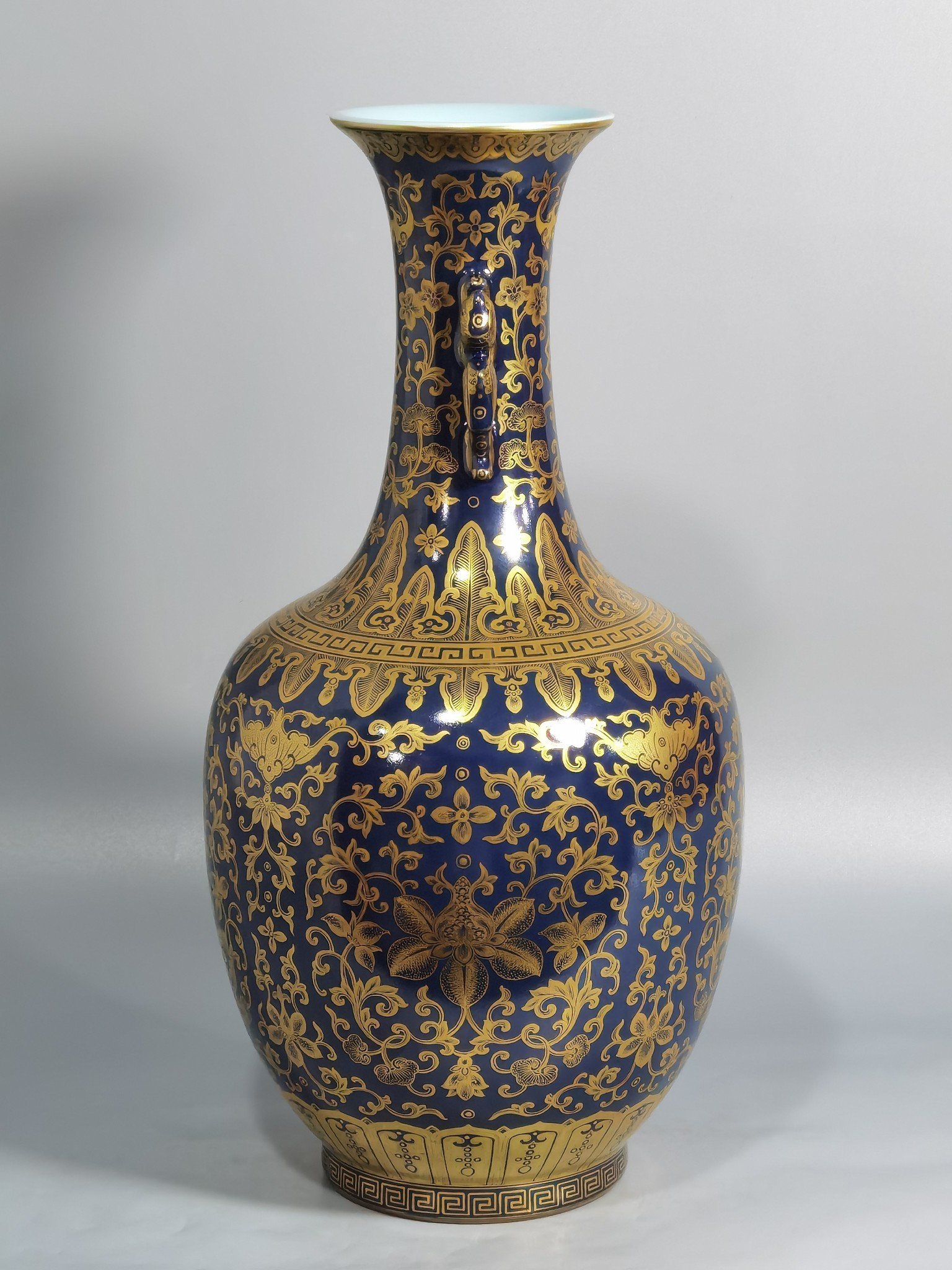Qing Dynasty Qianlong blue-painted golden treasure pattern with double-dragon ear and mouth-shaped bottle