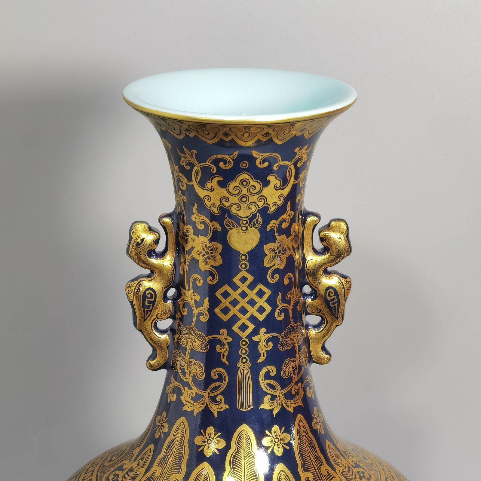 Qing Dynasty Qianlong blue-painted golden treasure pattern with double-dragon ear and mouth-shaped bottle