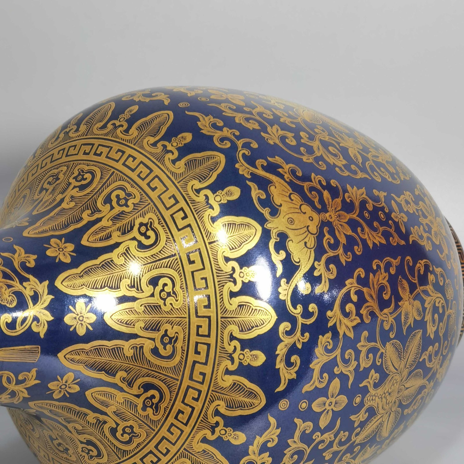 Qing Dynasty Qianlong blue-painted golden treasure pattern with double-dragon ear and mouth-shaped bottle