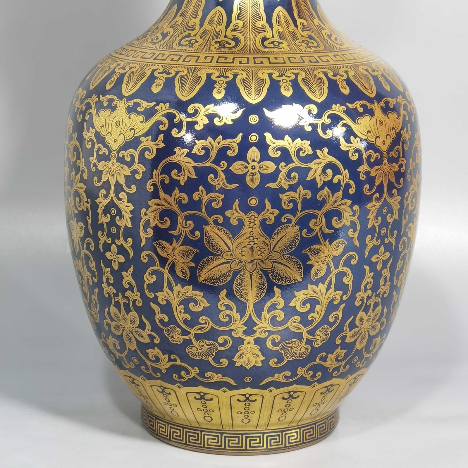Qing Dynasty Qianlong blue-painted golden treasure pattern with double-dragon ear and mouth-shaped bottle
