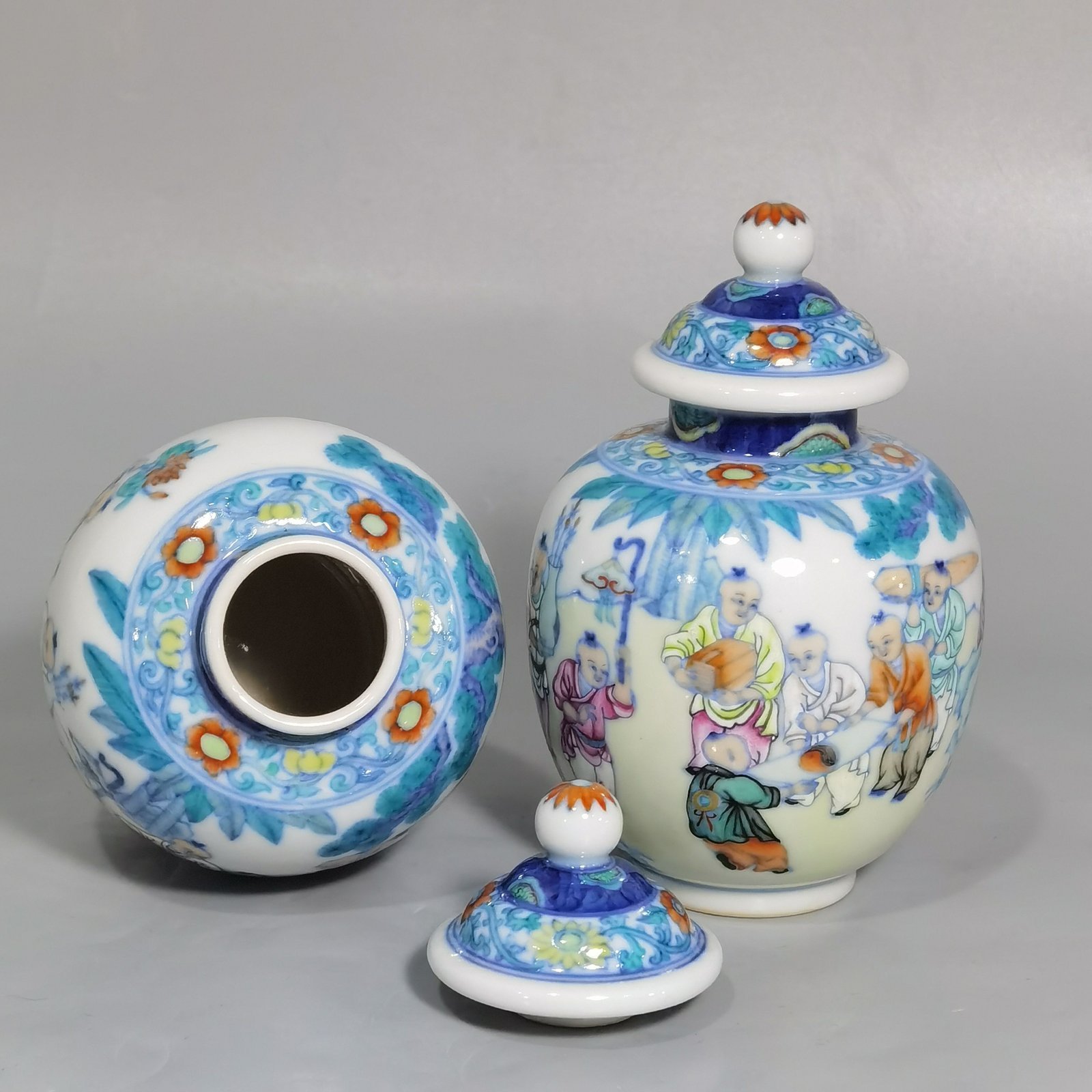 Qing Dynasty Qianlong blue and white colored baby playing picture covered jar