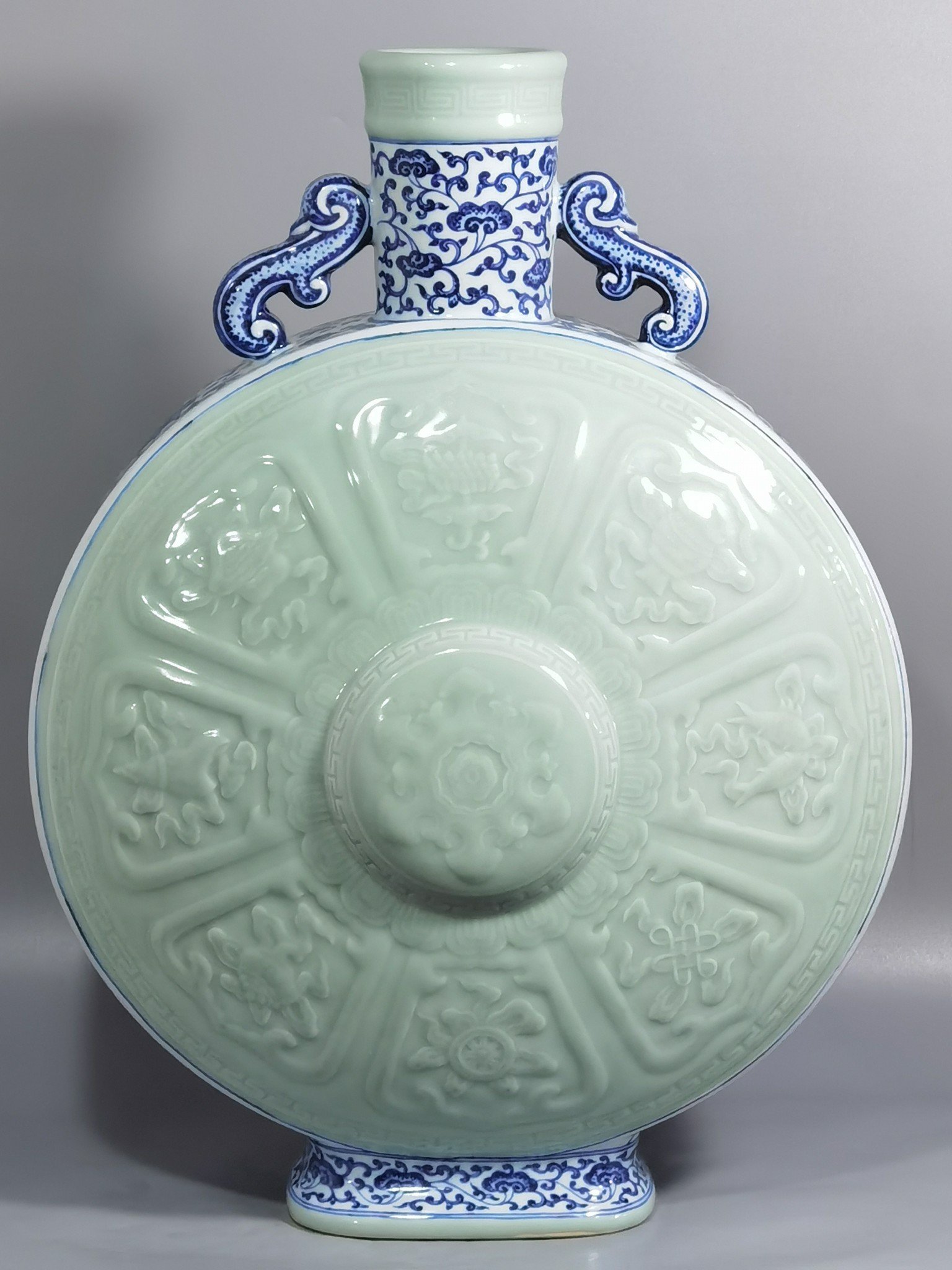 Qing Dynasty Qianlong blue and white lotus bean green glaze double ears and moon holding flat vase
