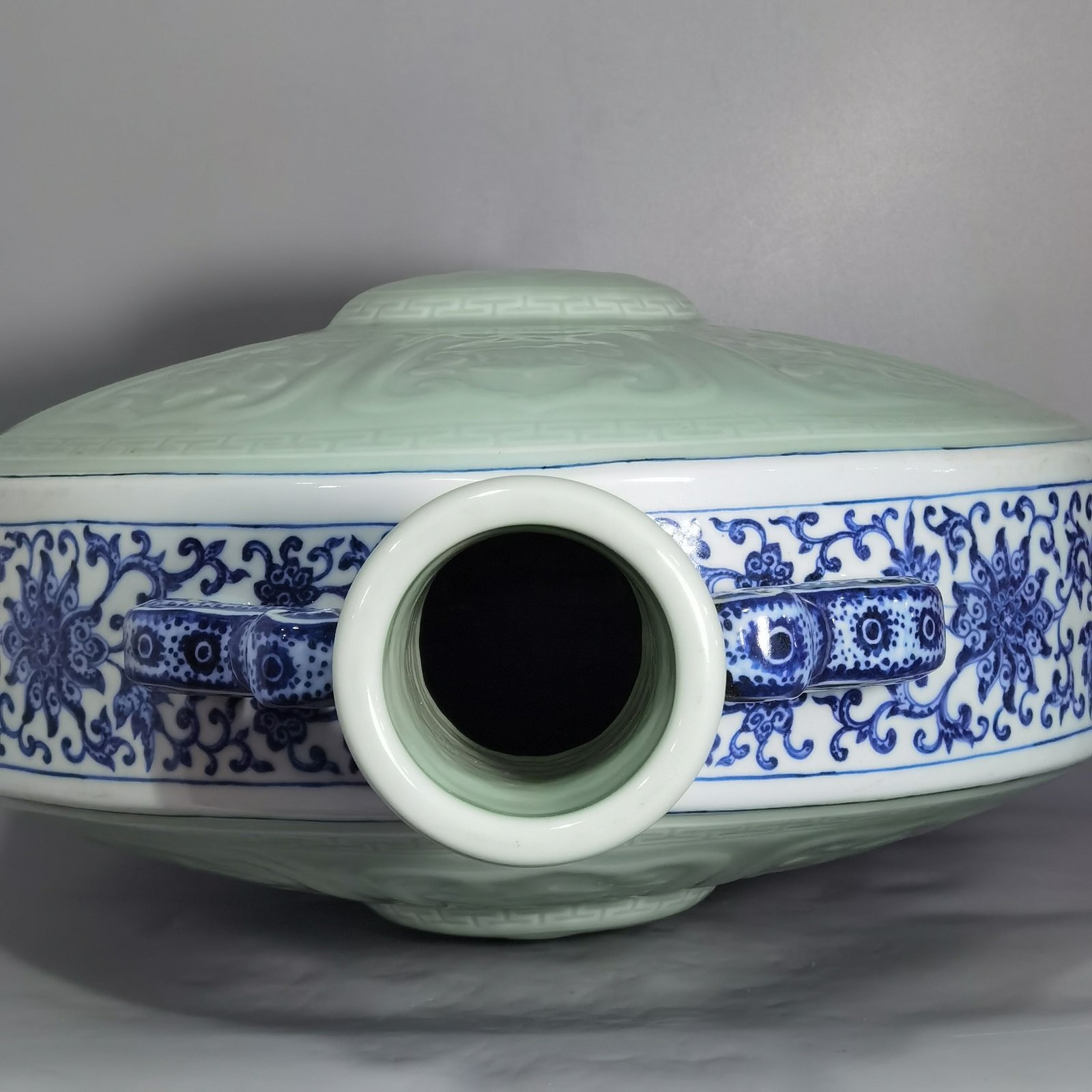 Qing Dynasty Qianlong blue and white lotus bean green glaze double ears and moon holding flat vase