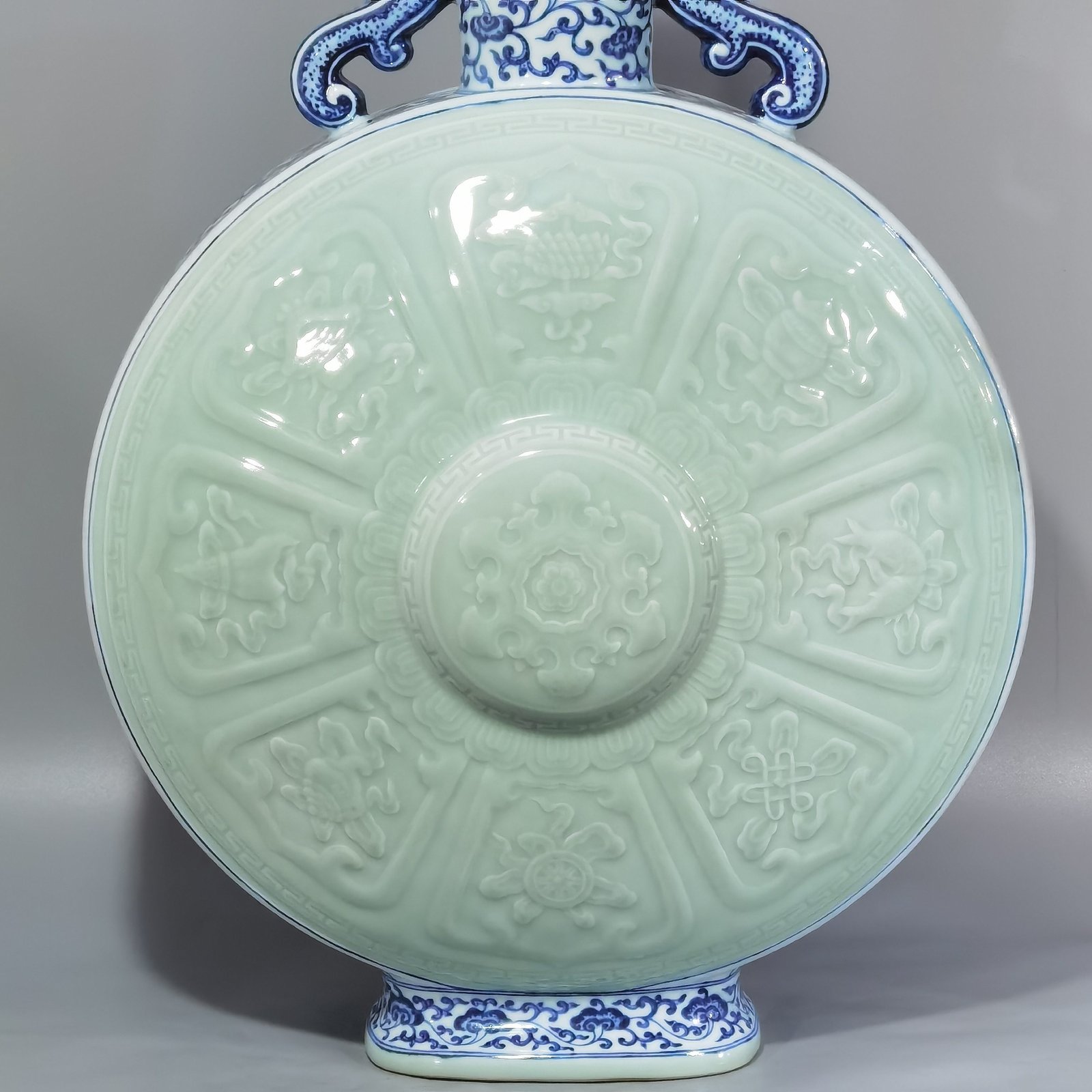 Qing Dynasty Qianlong blue and white lotus bean green glaze double ears and moon holding flat vase