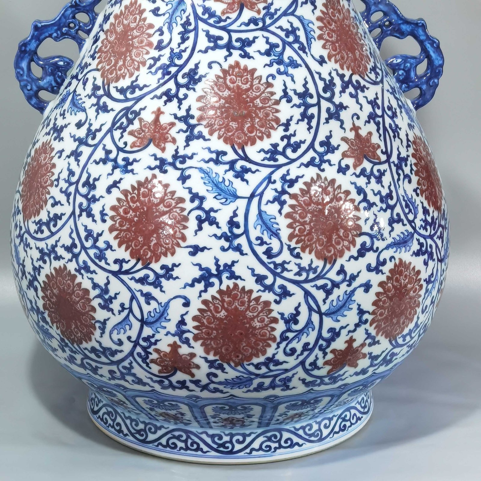 Qing Dynasty Qianlong blue and white glazed red lotus pattern Ruyi ear blessing barrel