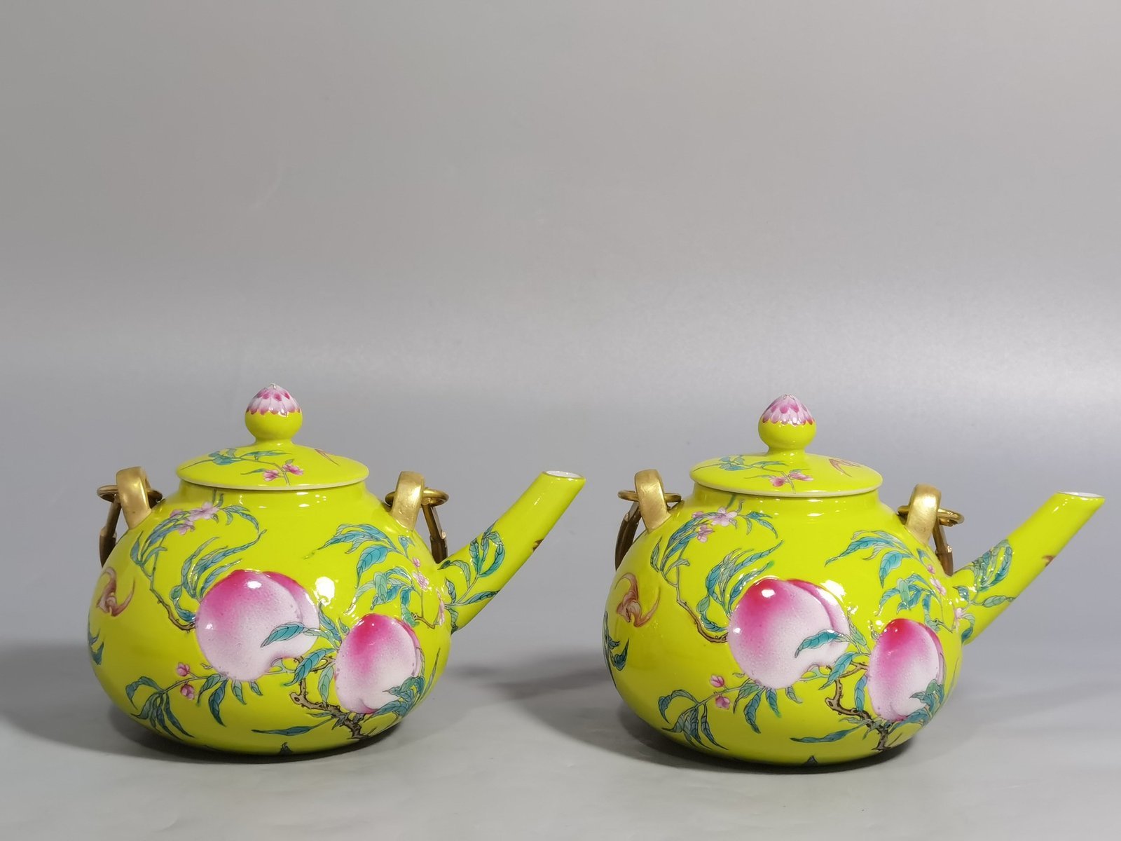 Qing Dynasty Qianlong yellow ground pastel five peach and five blessing teapot