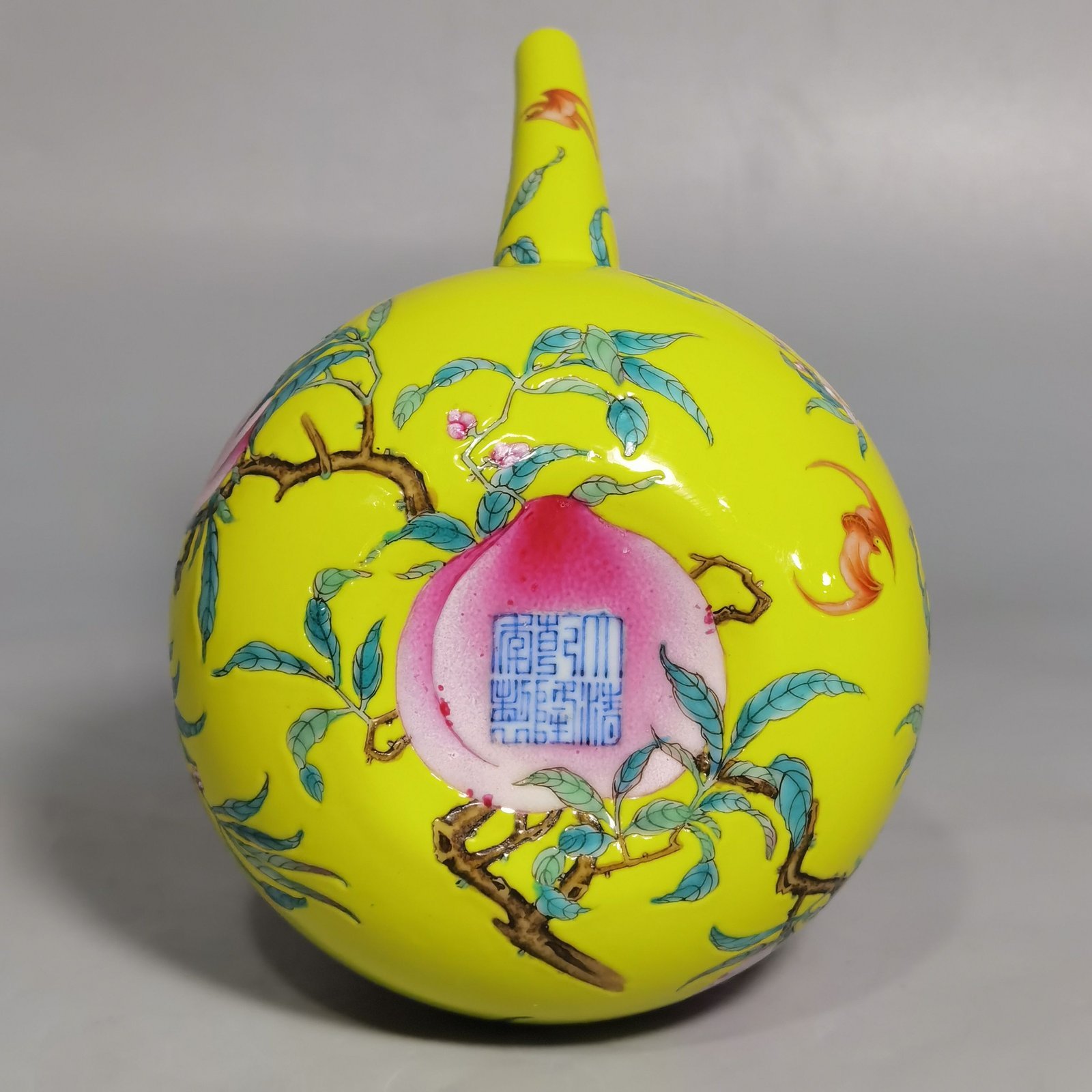 Qing Dynasty Qianlong yellow ground pastel five peach and five blessing teapot