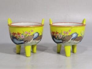 Qing Dynasty Qianlong yellow ground pastel quail pattern three-legged incense burner