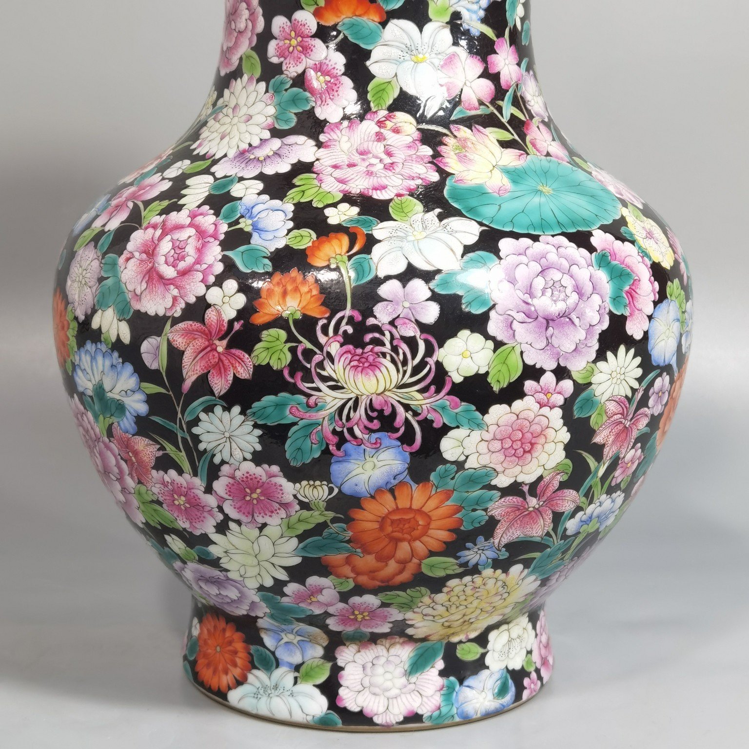 Qing Dynasty Qianlong black ground pastel colored mouth-washing bottle