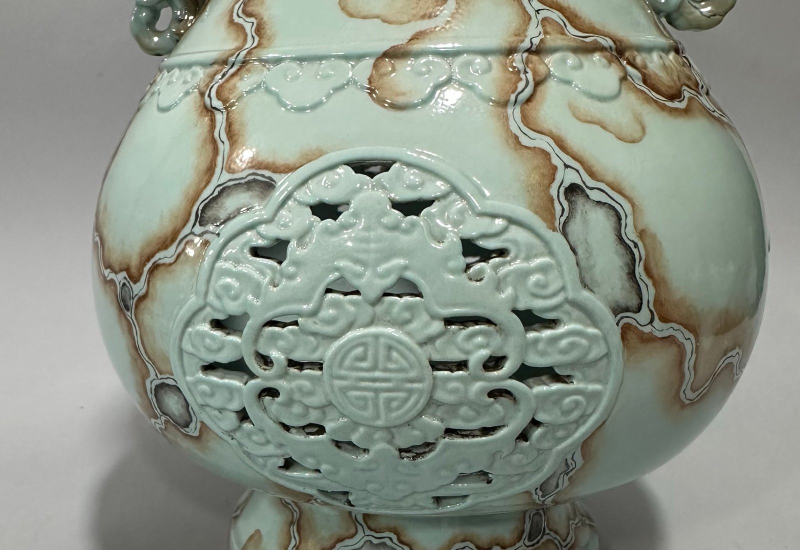 Qing Dynasty Qianlong Pastel turquoise green glaze stone pattern carved hollow Fushou bat amphora