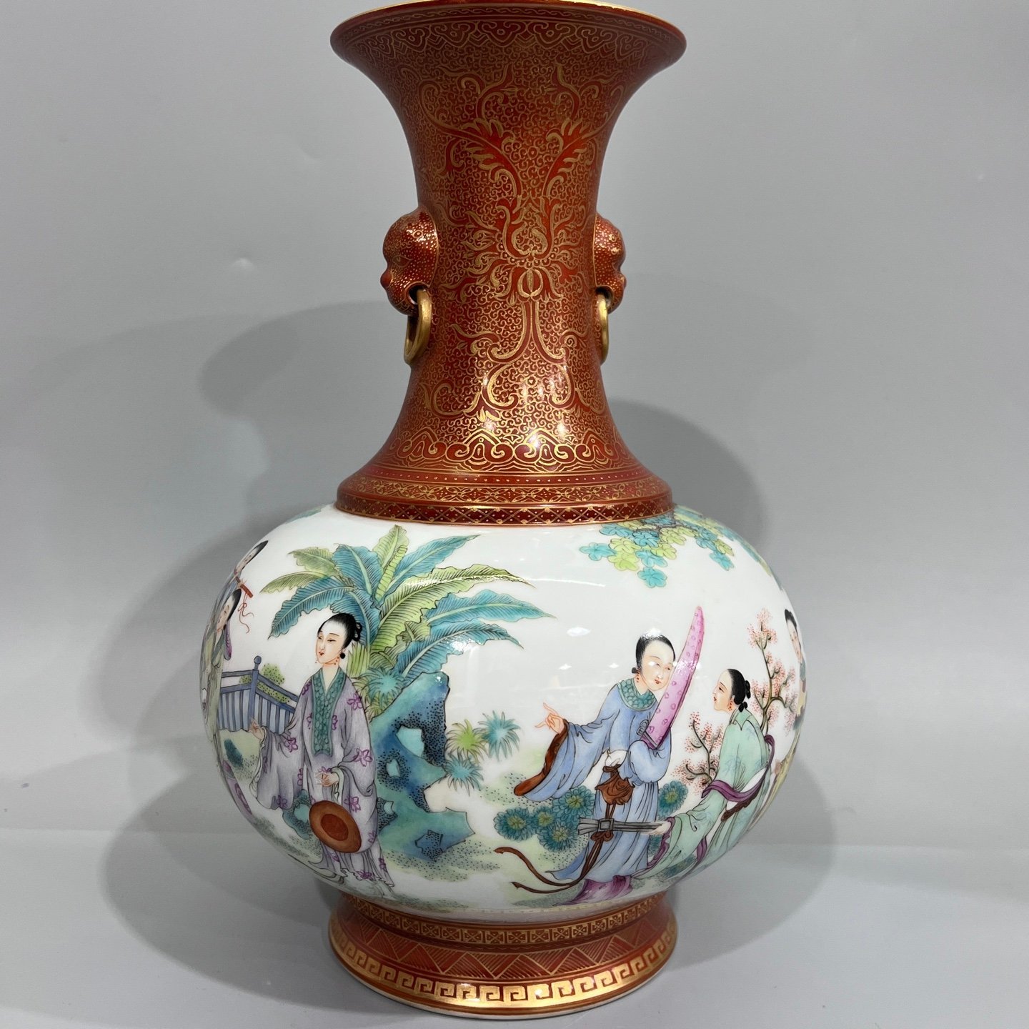 Qing Dynasty alum red gilt on top and bottom and pastel figures pair of two-ear vase