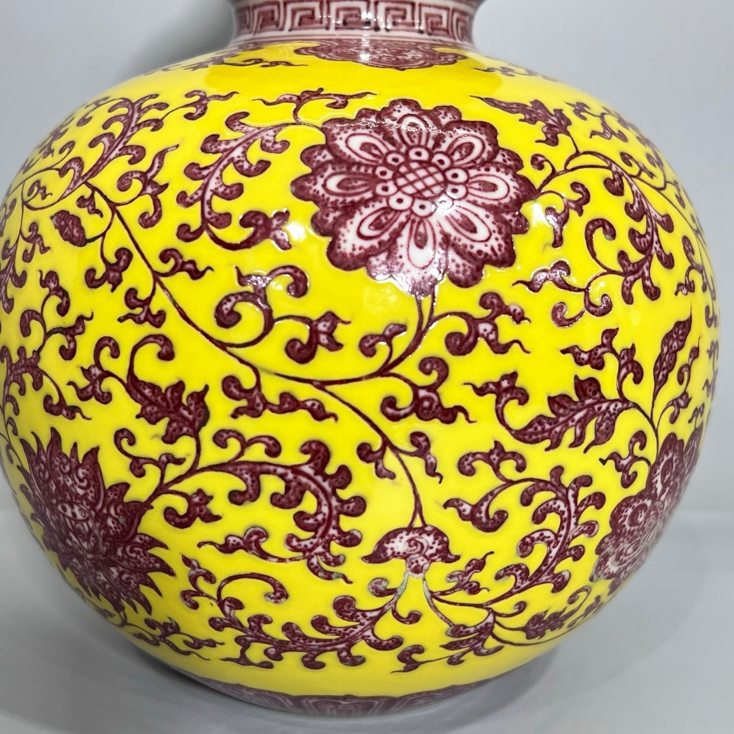 Qing Dynasty Qianlong A gourd vase with yellow ground and red underglaze with lotus pattern