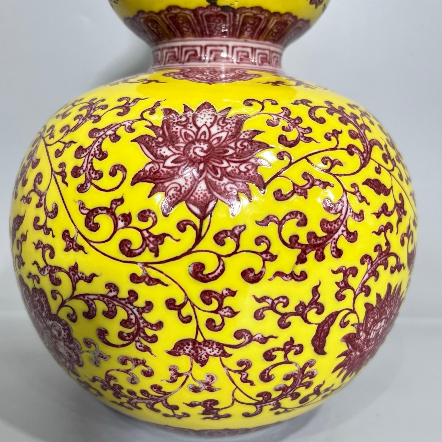 Qing Dynasty Qianlong A gourd vase with yellow ground and red underglaze with lotus pattern
