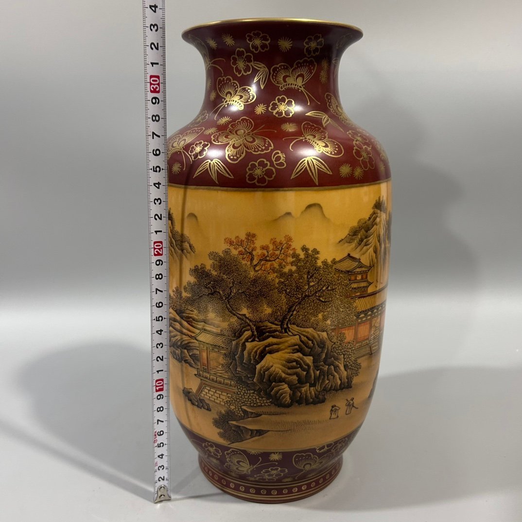 Qing Dynasty Qianlong wood grain ink color landscape winter melon vase