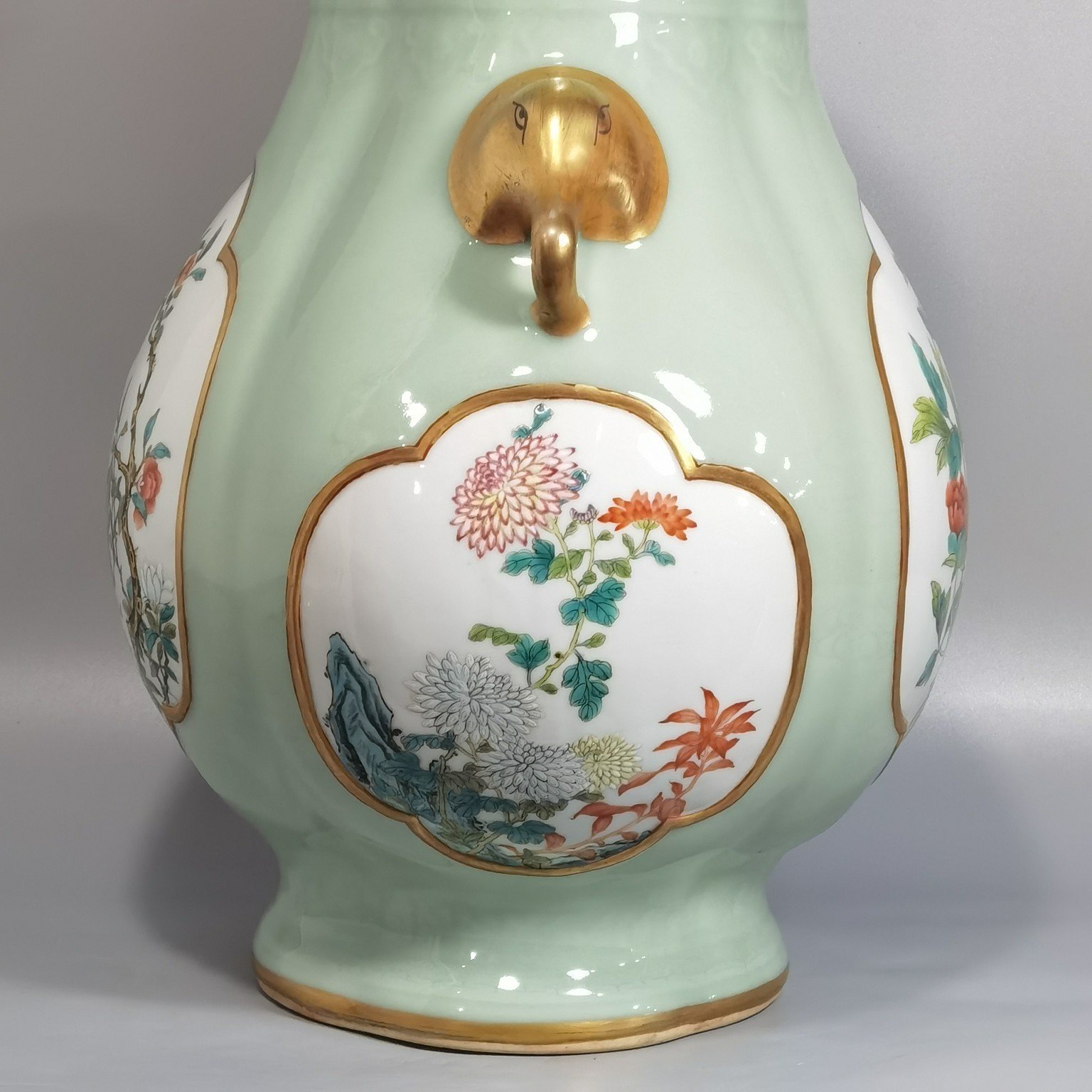 Qing Dynasty Qianlong Pale celadon-glazed haitang shaped vase with elephant-head handles