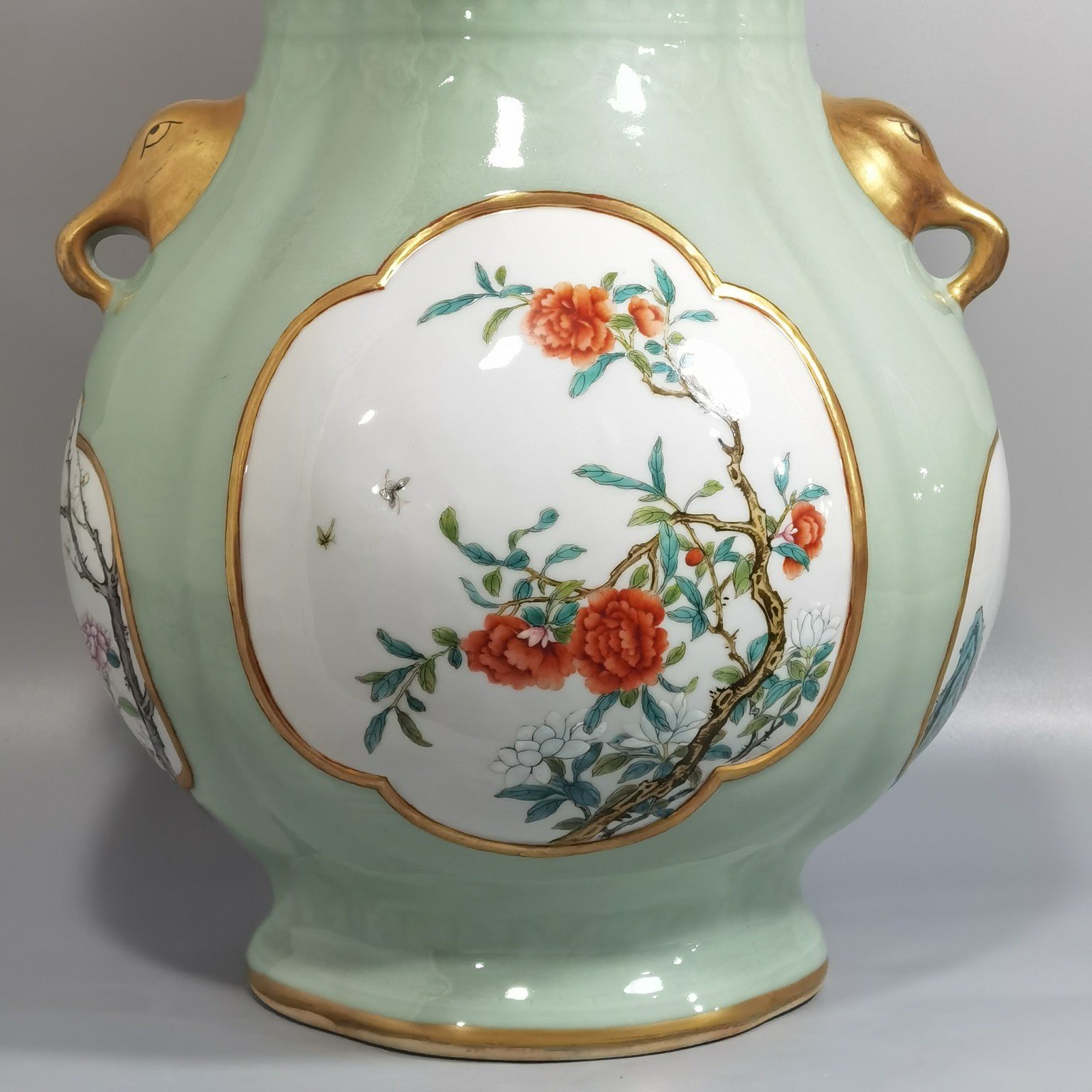 Qing Dynasty Qianlong Pale celadon-glazed haitang shaped vase with elephant-head handles