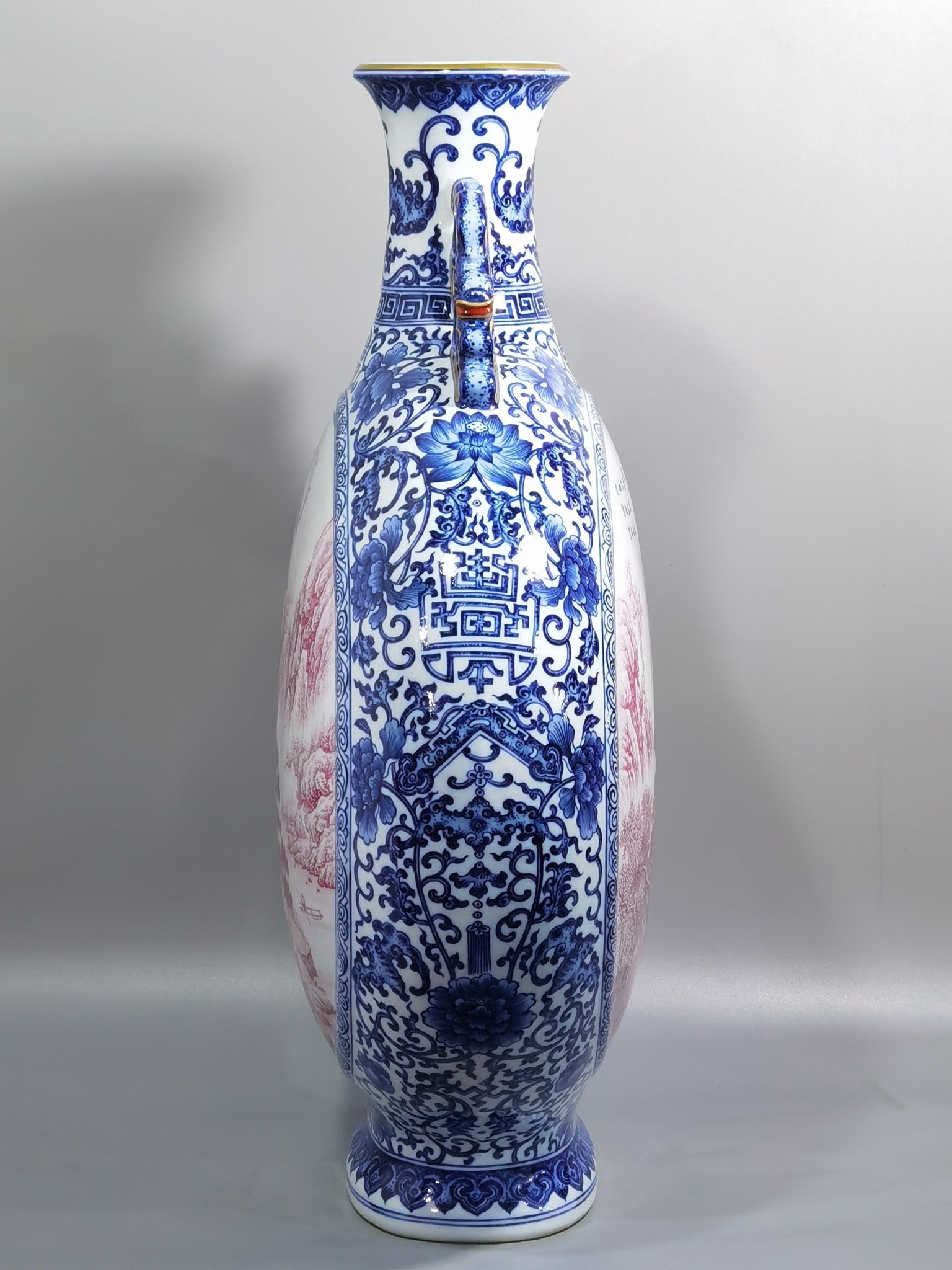 Qing Dynasty Qianlong blue and white enamel agate and red landscape figures flat bottle