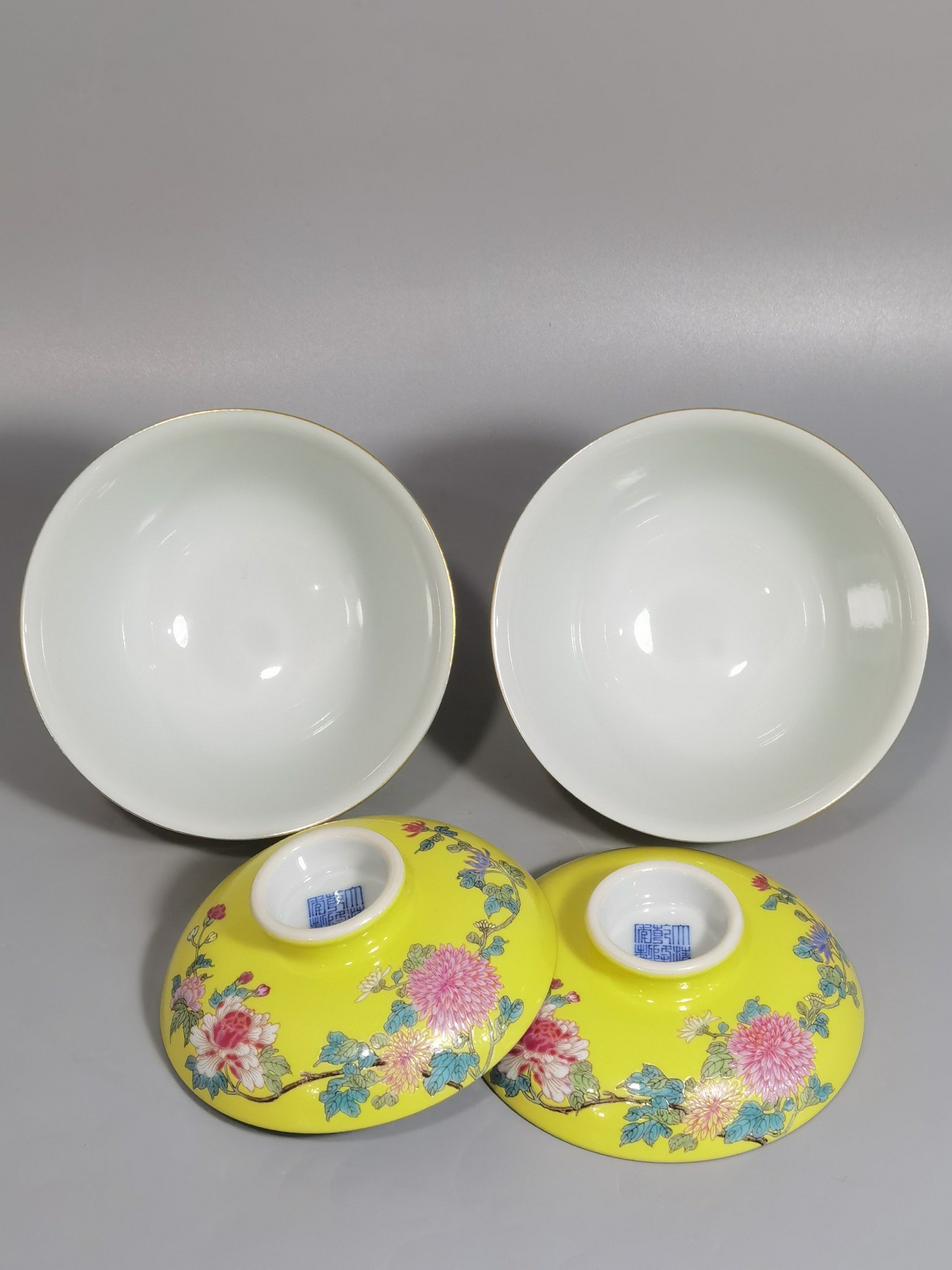 Qing Dynasty Qianlong pair of yellow ground pastel hibiscus flower bowls