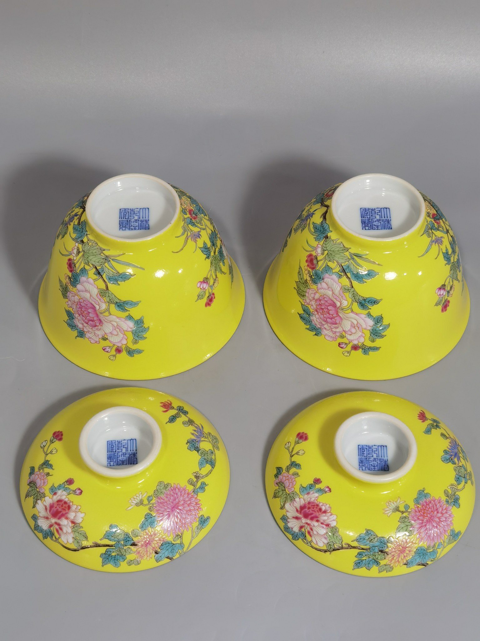 Qing Dynasty Qianlong pair of yellow ground pastel hibiscus flower bowls
