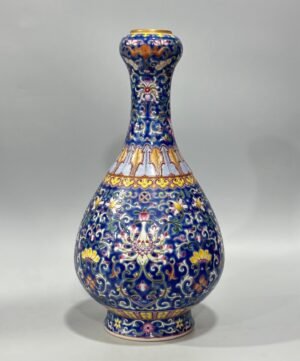 Qing Dynasty Qianlong Yangcai blue ground bat passion fruit and garlic vase