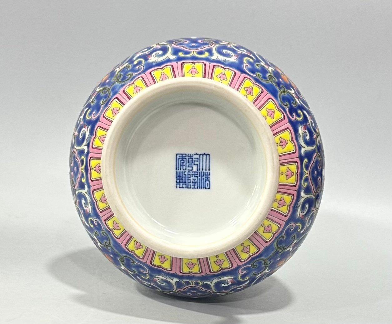 Qing Dynasty Qianlong Yangcai blue ground bat passion fruit and garlic vase
