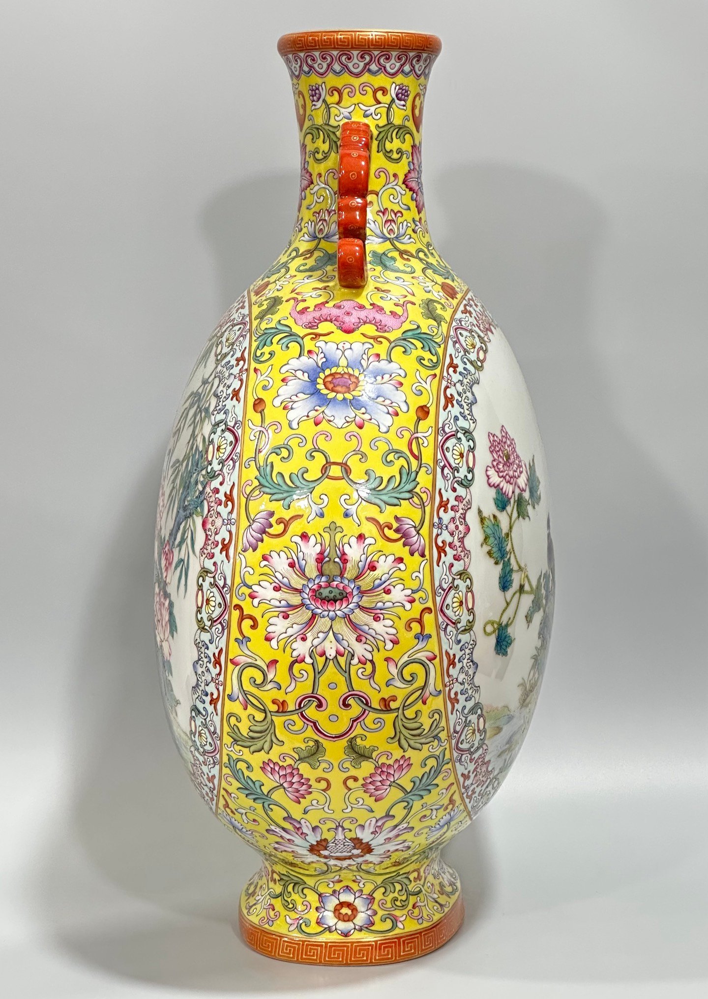 Qing Dynasty Qianlong Yangcai yellow ground flowers entwining branches double ears holding the moon vase