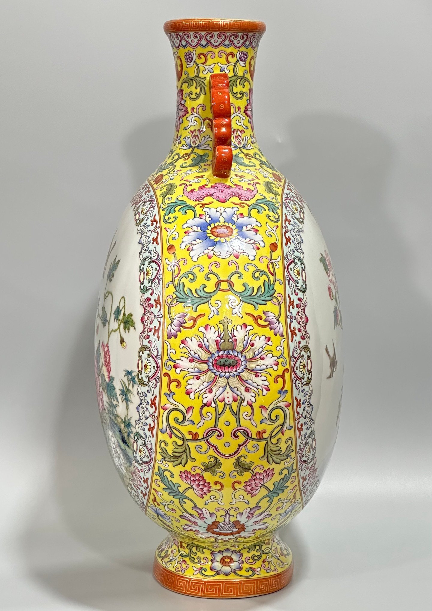 Qing Dynasty Qianlong Yangcai yellow ground flowers entwining branches double ears holding the moon vase