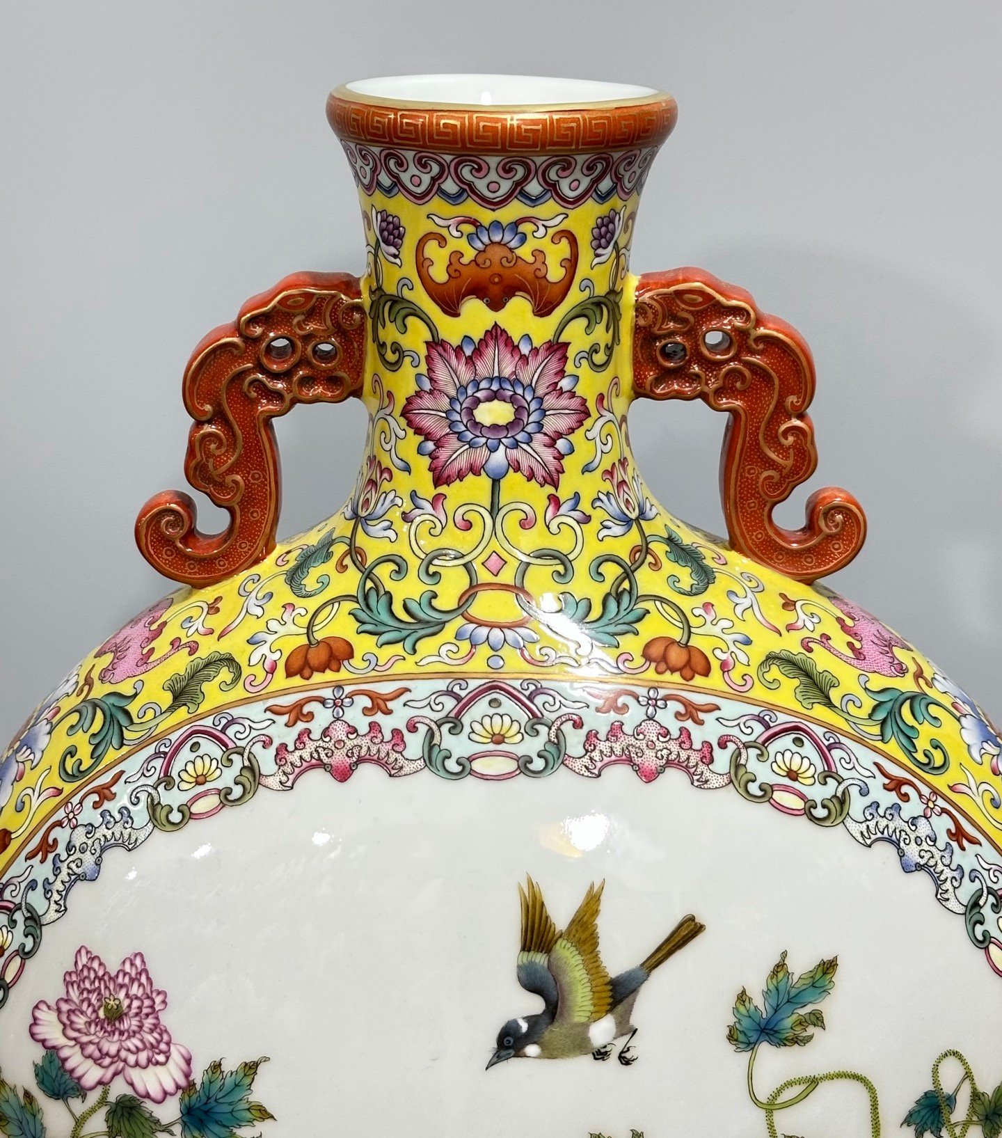 Qing Dynasty Qianlong Yangcai yellow ground flowers entwining branches double ears holding the moon vase