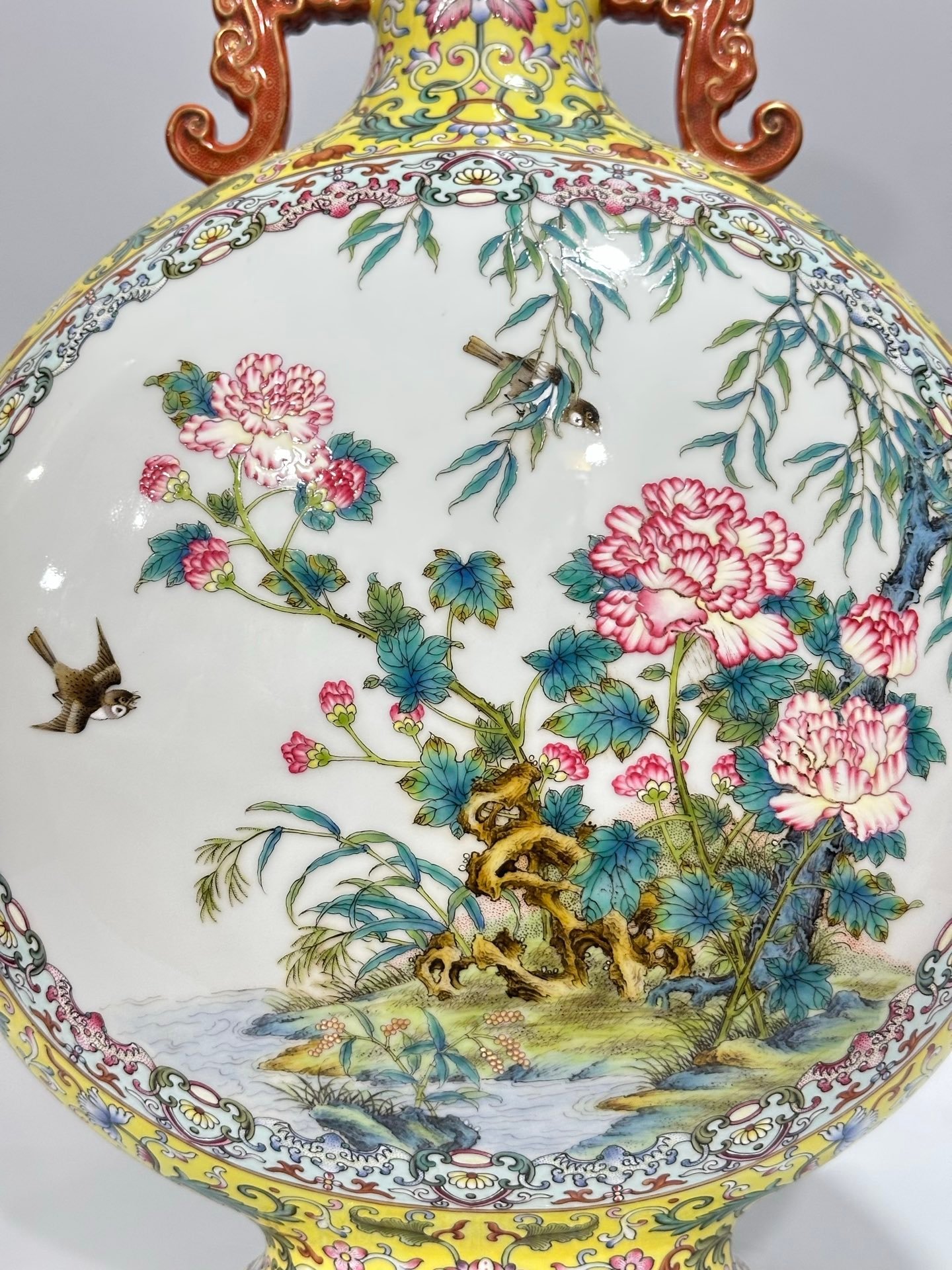 Qing Dynasty Qianlong Yangcai yellow ground flowers entwining branches double ears holding the moon vase