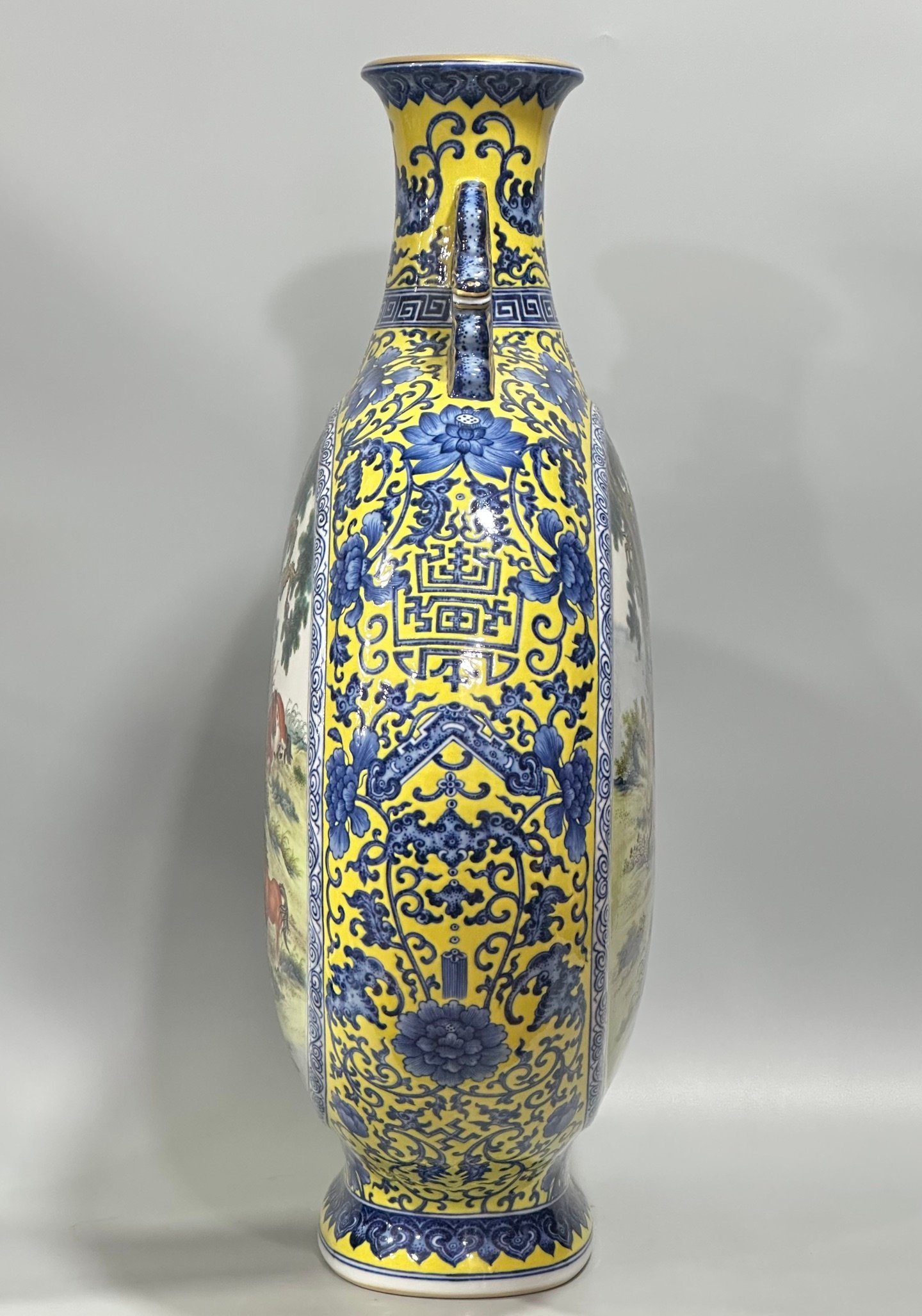 Qing Dynasty Qianlong Enamel vase with blue and white flowers on yellow ground