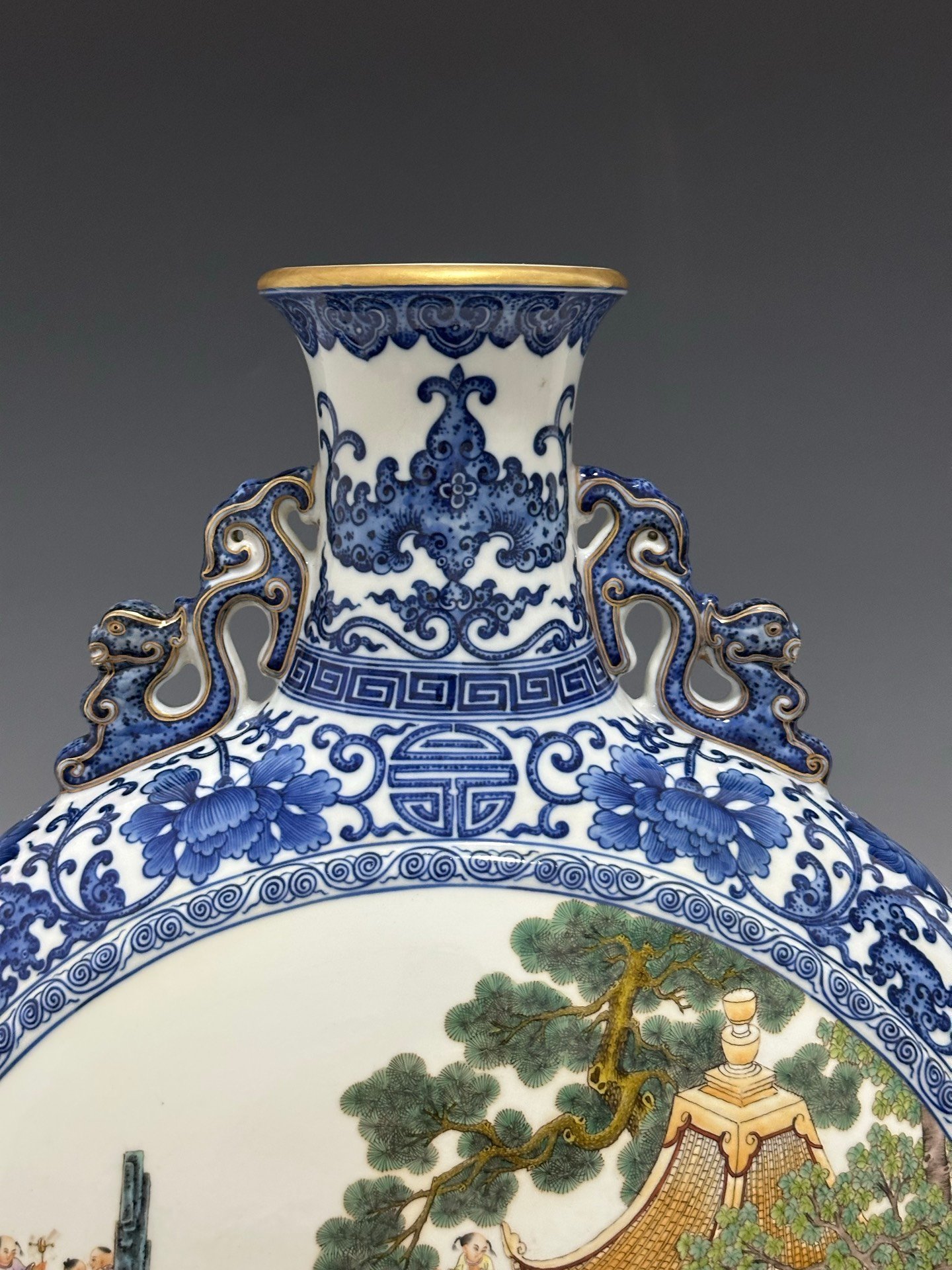 Qing Dynasty Qianlong Pastel blue and white flowers with hundred figures double ears holding the moon vase