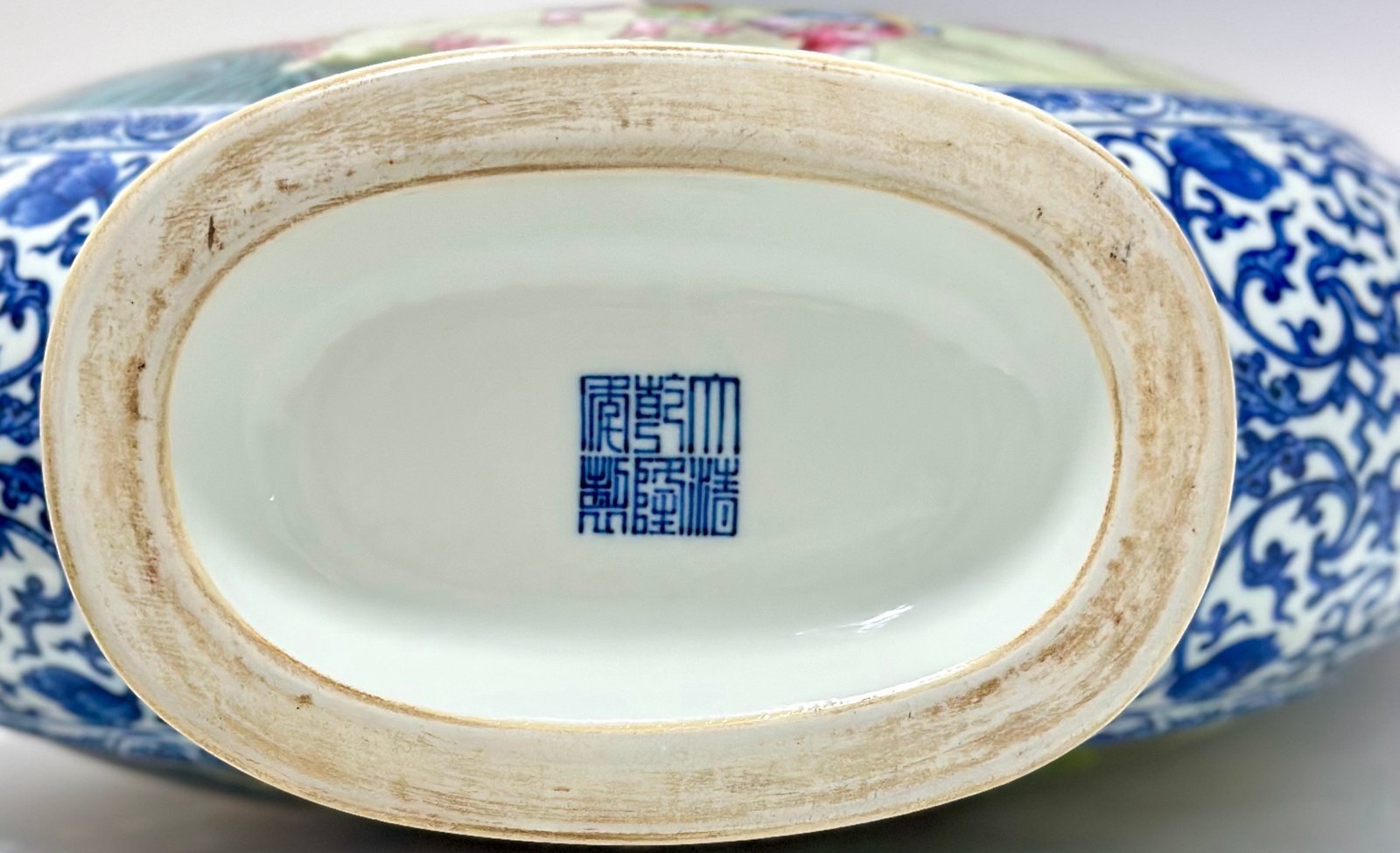 Qing Dynasty Qianlong Pastel blue and white flowers with hundred figures double ears holding the moon vase