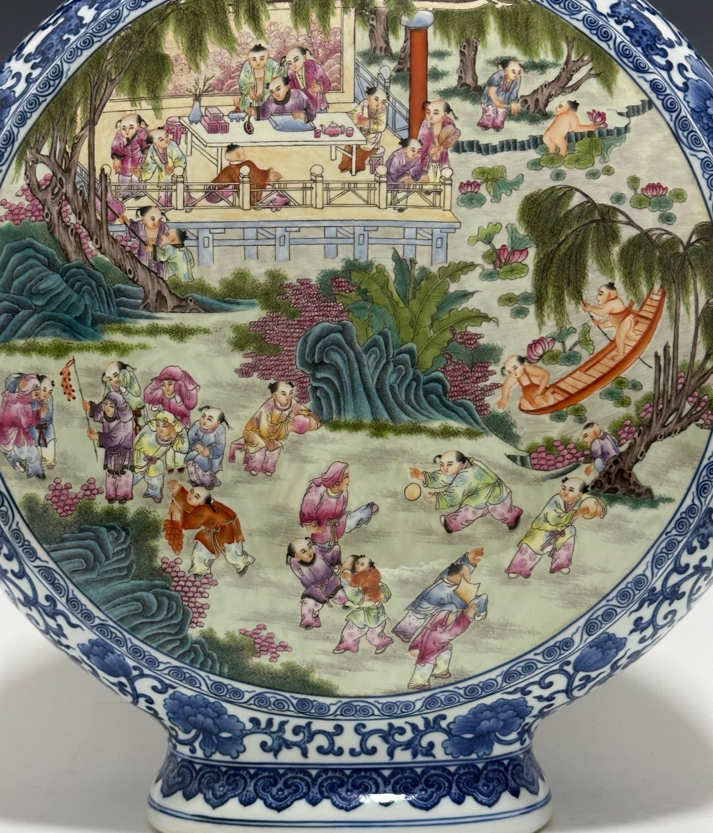 Qing Dynasty Qianlong Pastel blue and white flowers with hundred figures double ears holding the moon vase