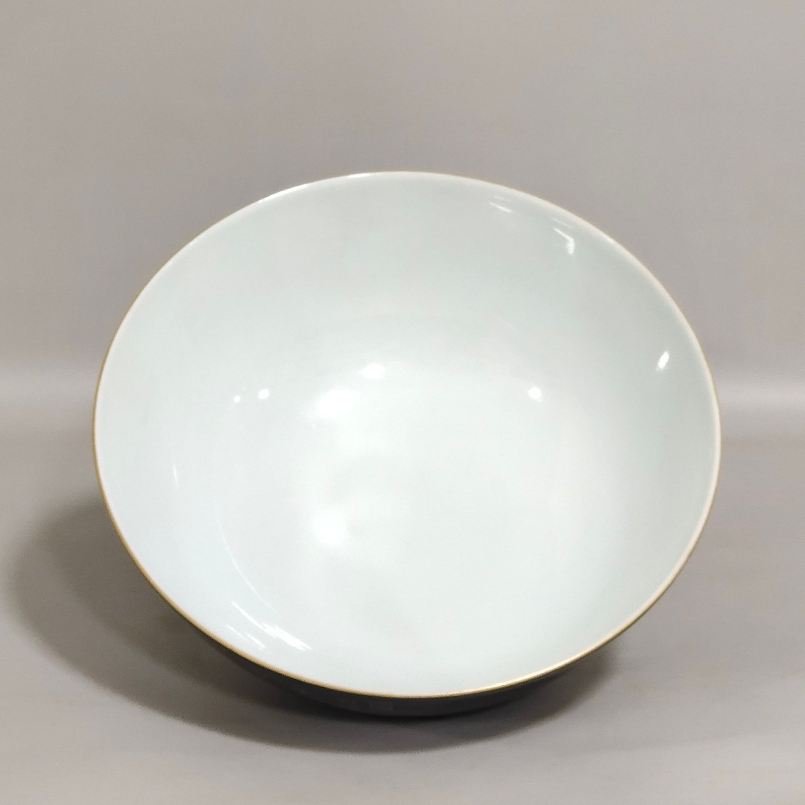 Qing Dynasty Qianlong black gold glazed red-crowned crane and flower poetry bowl