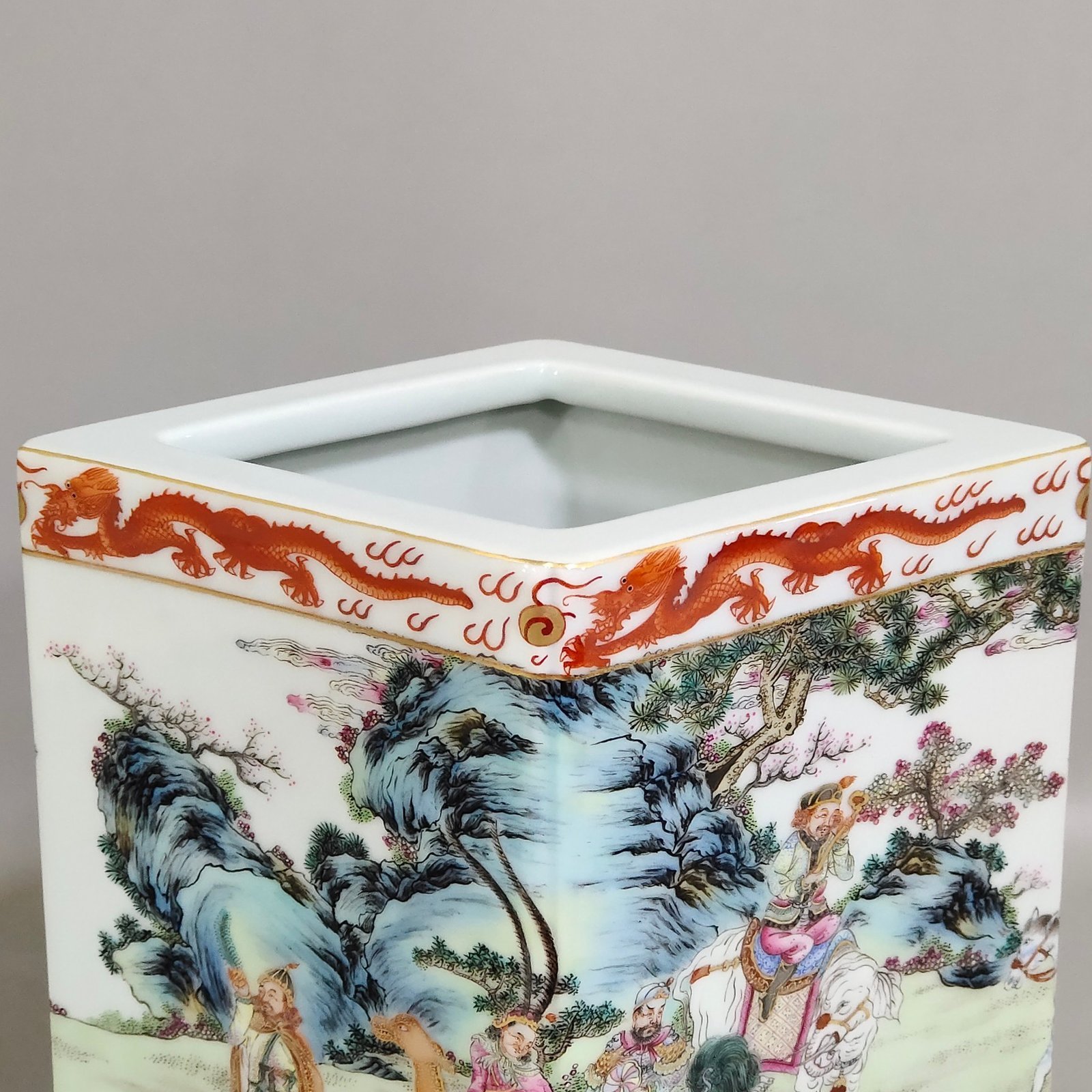 Qing Dynasty Qianlong Gong red dragon pattern square prismatic pen holder with eight barbarians