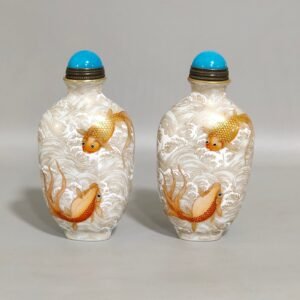 Qing Dynasty Qianlong goldfish snuff bottle with gold sea pattern