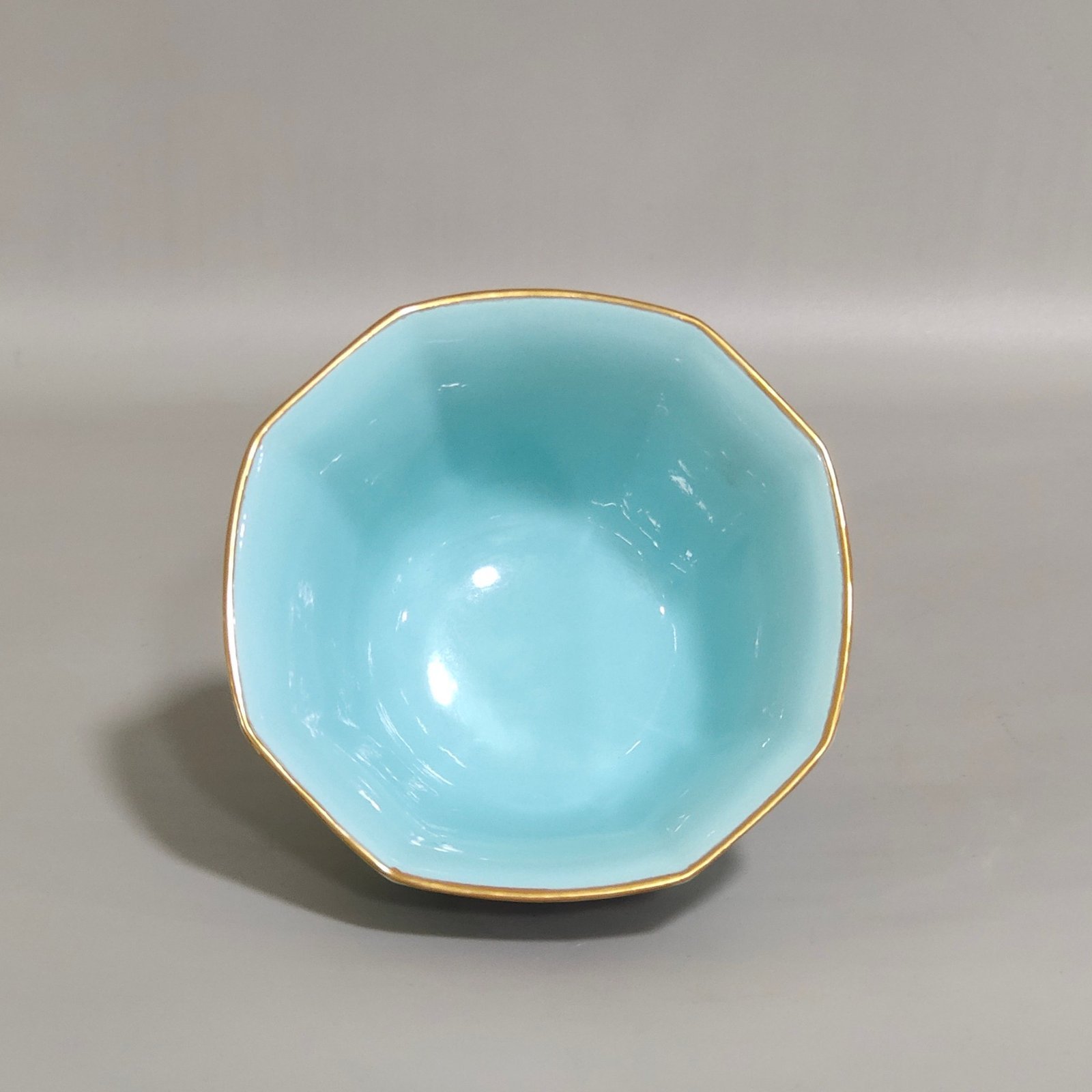 Qing Dynasty Qianlong turquoise green branched flowers and three more butterflies octagonal cup